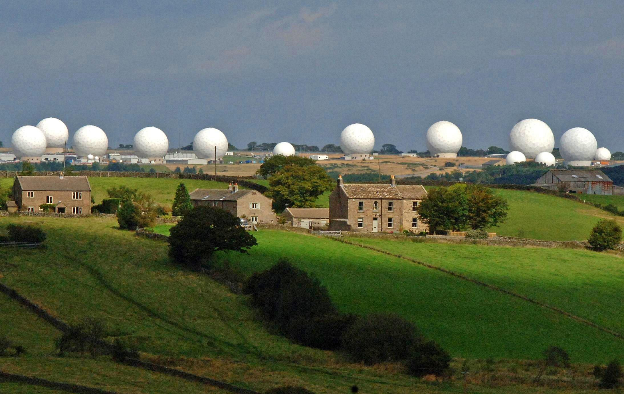 RAF Menwith Hill randomes with buildings in foreground (Picture: PA).
