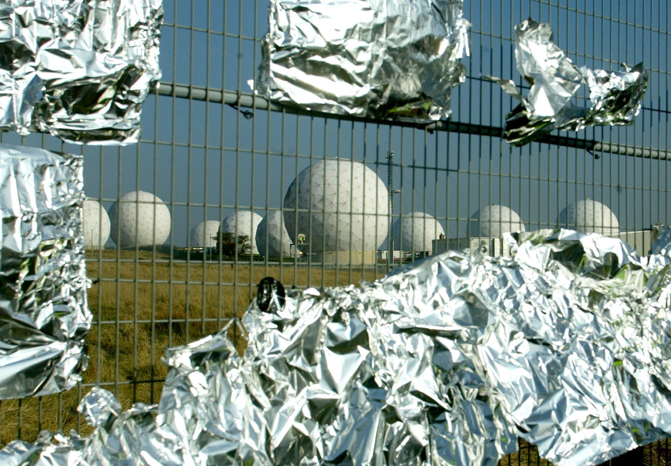 RAF Menwith Hill with foil on fence placed by protestors