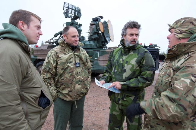 RAF Personnel talk with a member of the Swedish Air Force 040619 CREDIT MOD.jpg 