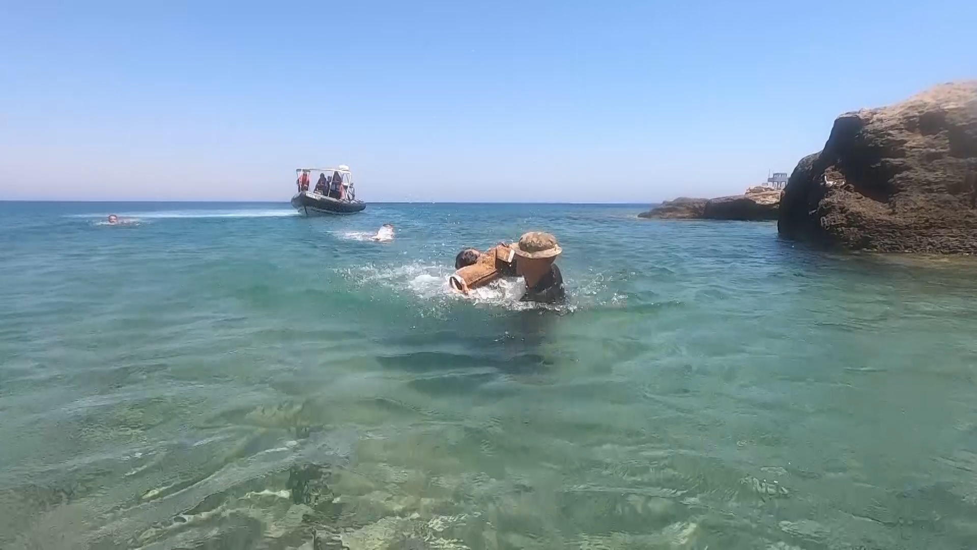 The dogs practised how to apprehend offenders in the sea.