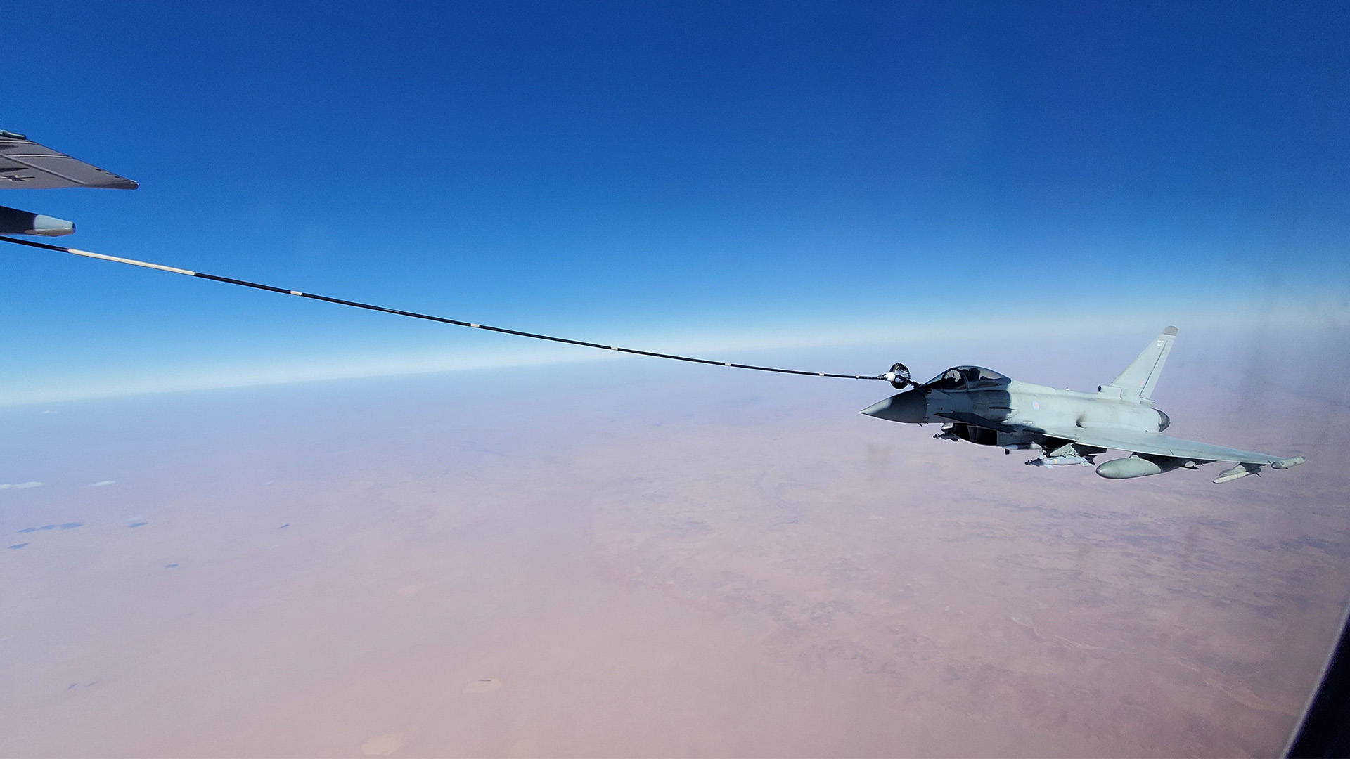A RAF Typhoon and a German Atlas A400M in the skies over the Middle East (Picture: MOD