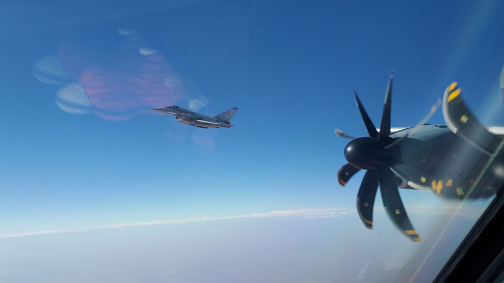 A RAF and German A400M refuel air-to-air