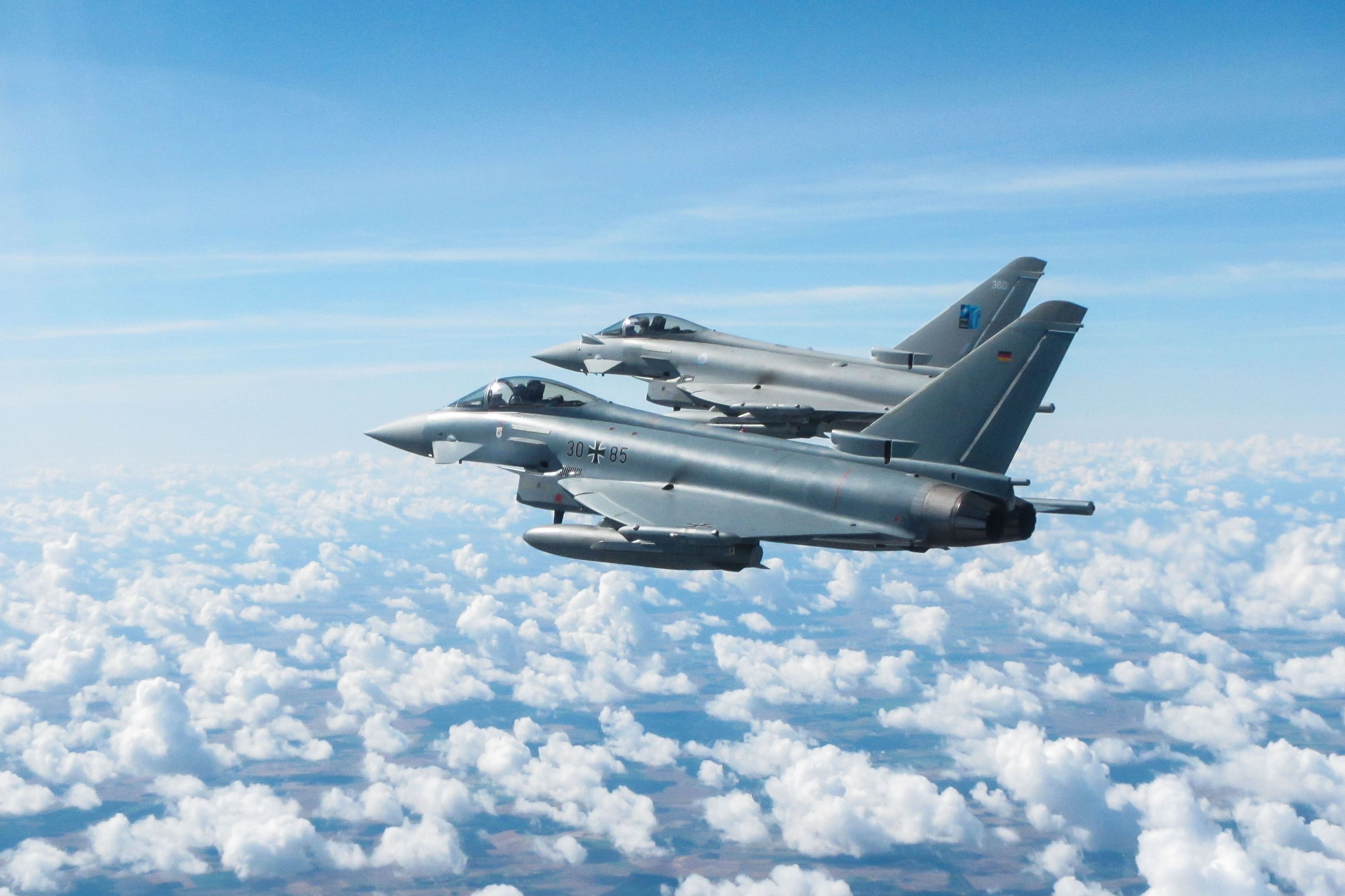 Cover image: An RAF Typhoon and German Air Force Eurofighter flying in formation during a practice interception mission over Lithuania (Picture: MOD).