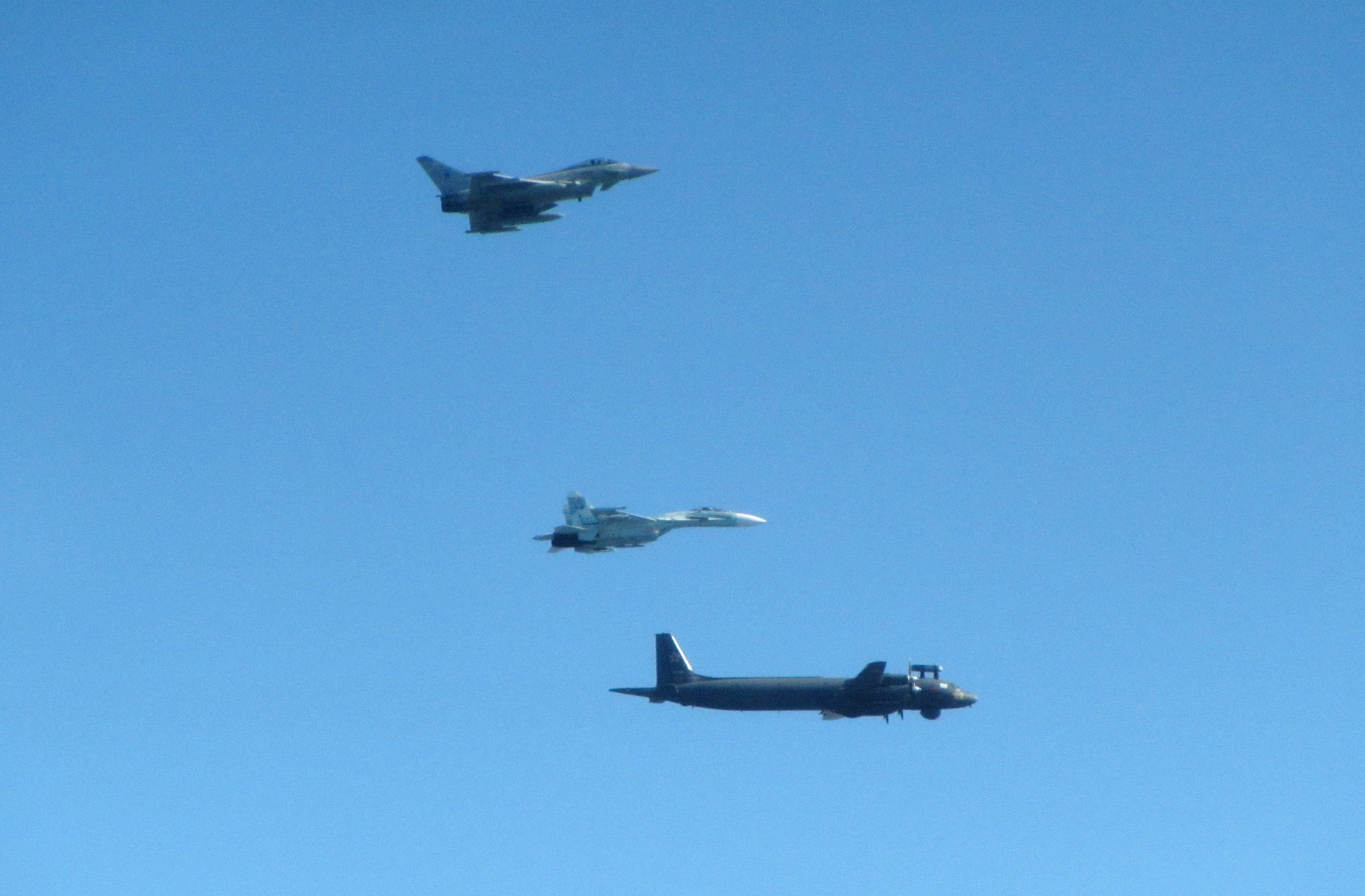 Cover image: RAF Typhoon pictured flying alongside two of the Russian jets (Picture: RAF).