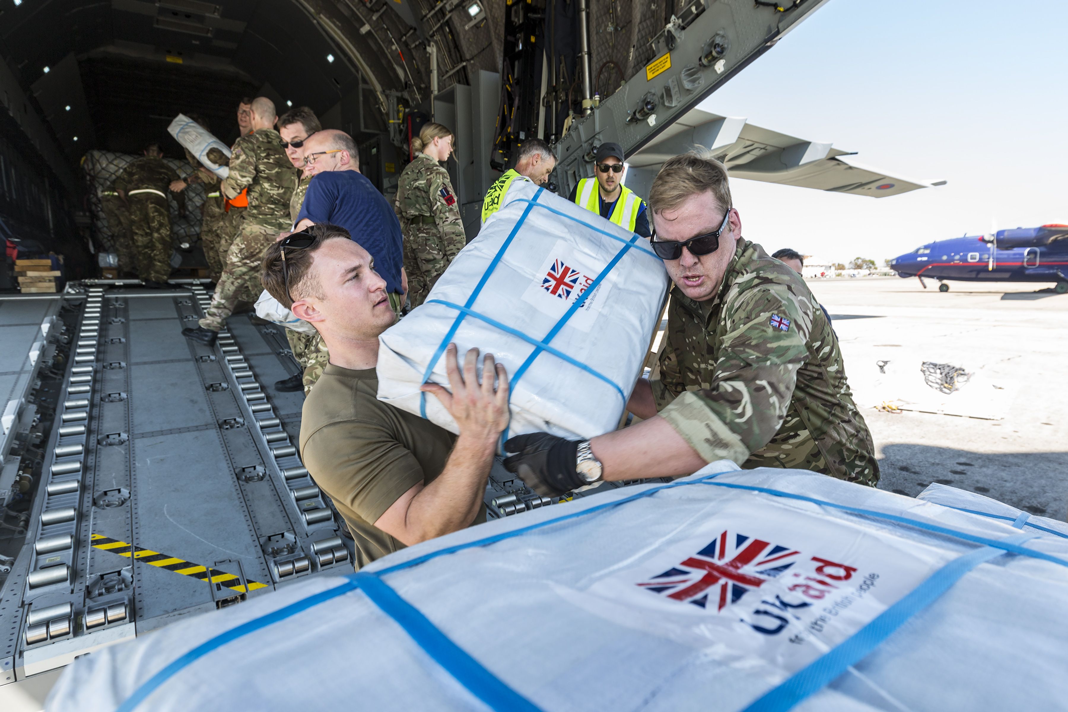 Unloading aid packages (Picture: MOD).