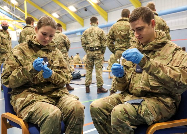 RAF personnel at RAF Leeming, North Yorkshire, undertaking training on how to administer coronavirus tests (Picture: MOD).