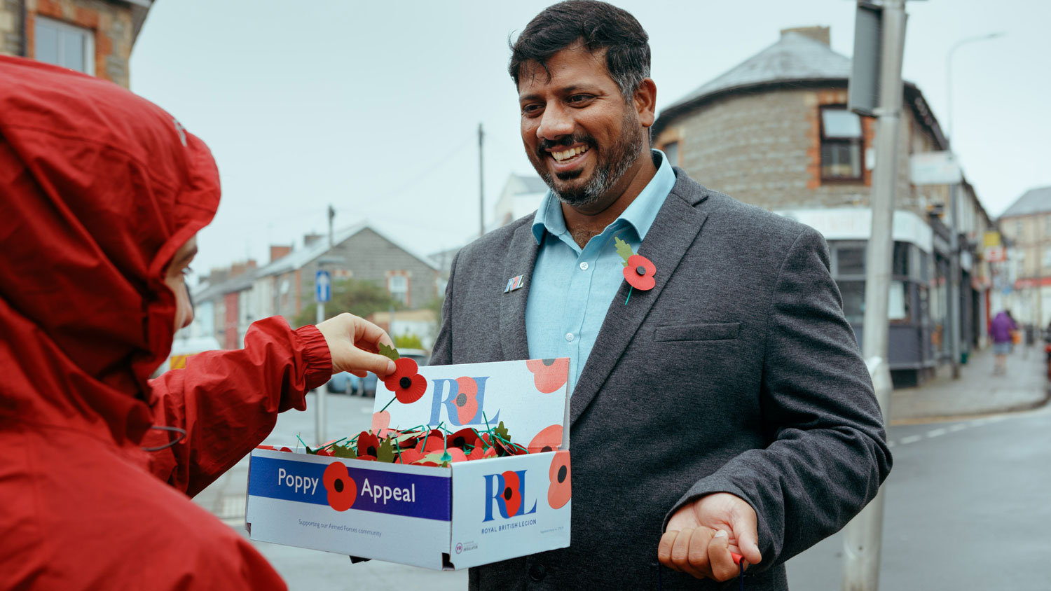 RBL Poppy Appeal Volunteer Mirza Shahzad Poppy Selling Picture Royal British Legion