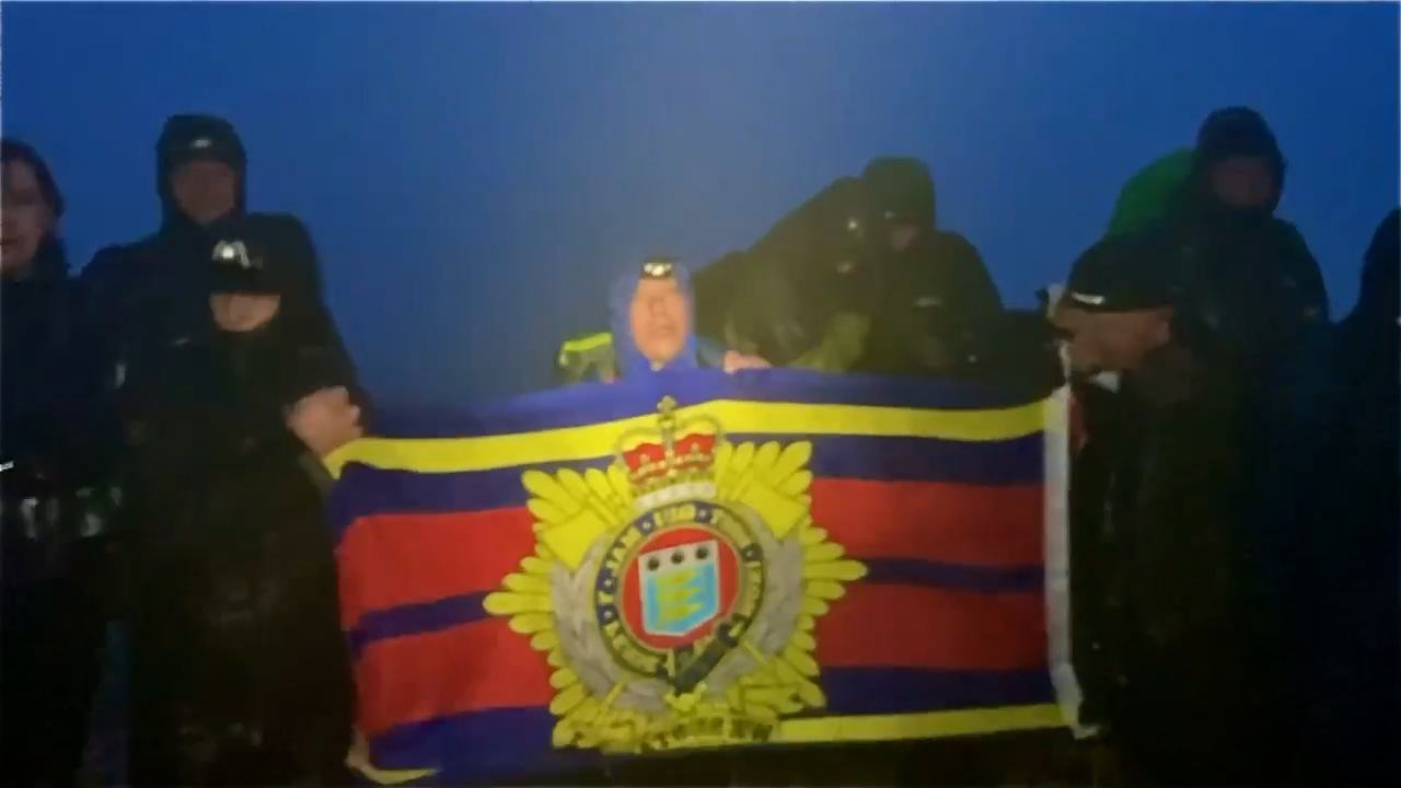 	RLC flag being raised on the top of Scafell Pike