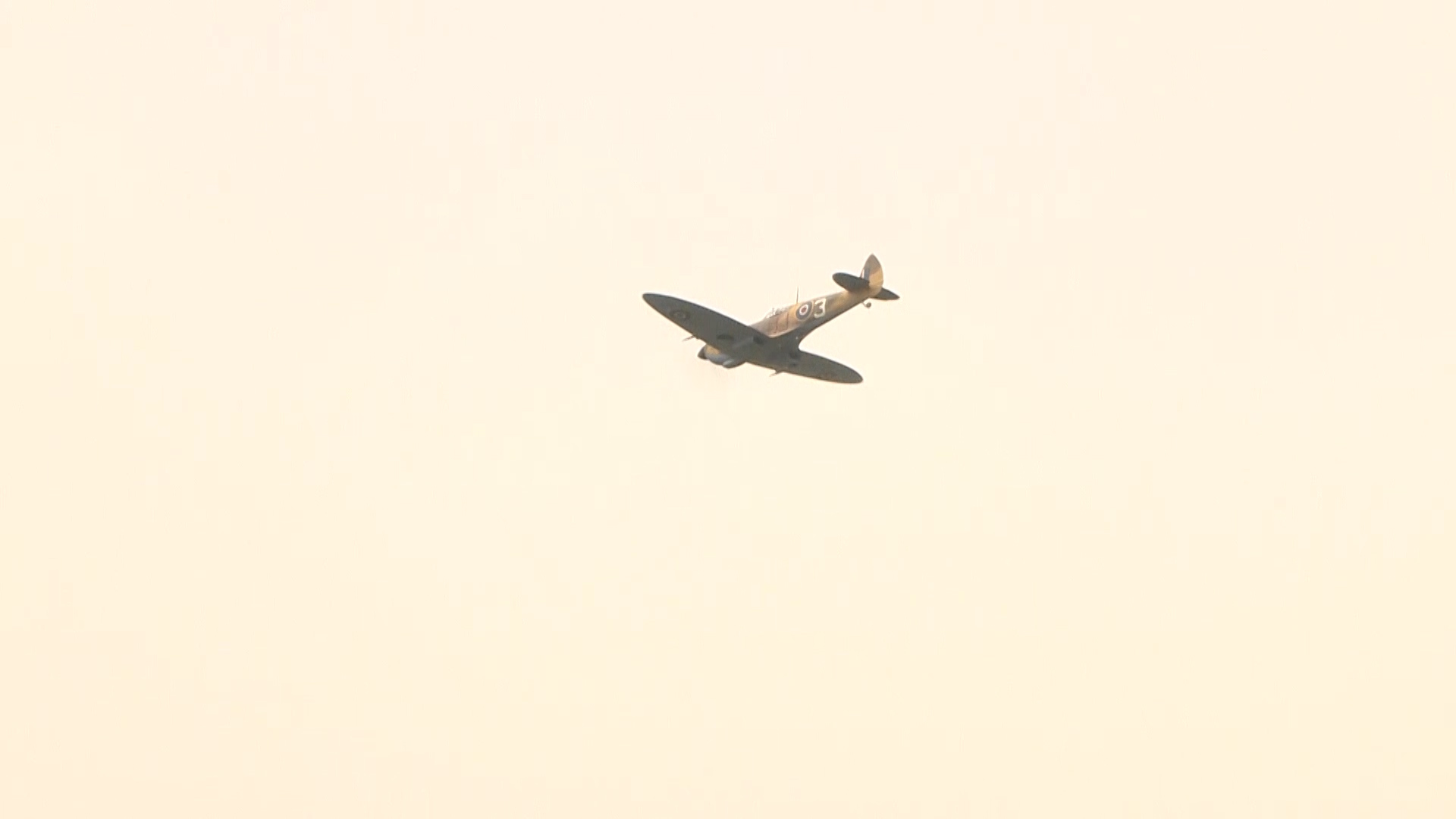 A spitfire flies over RAF Cranwell