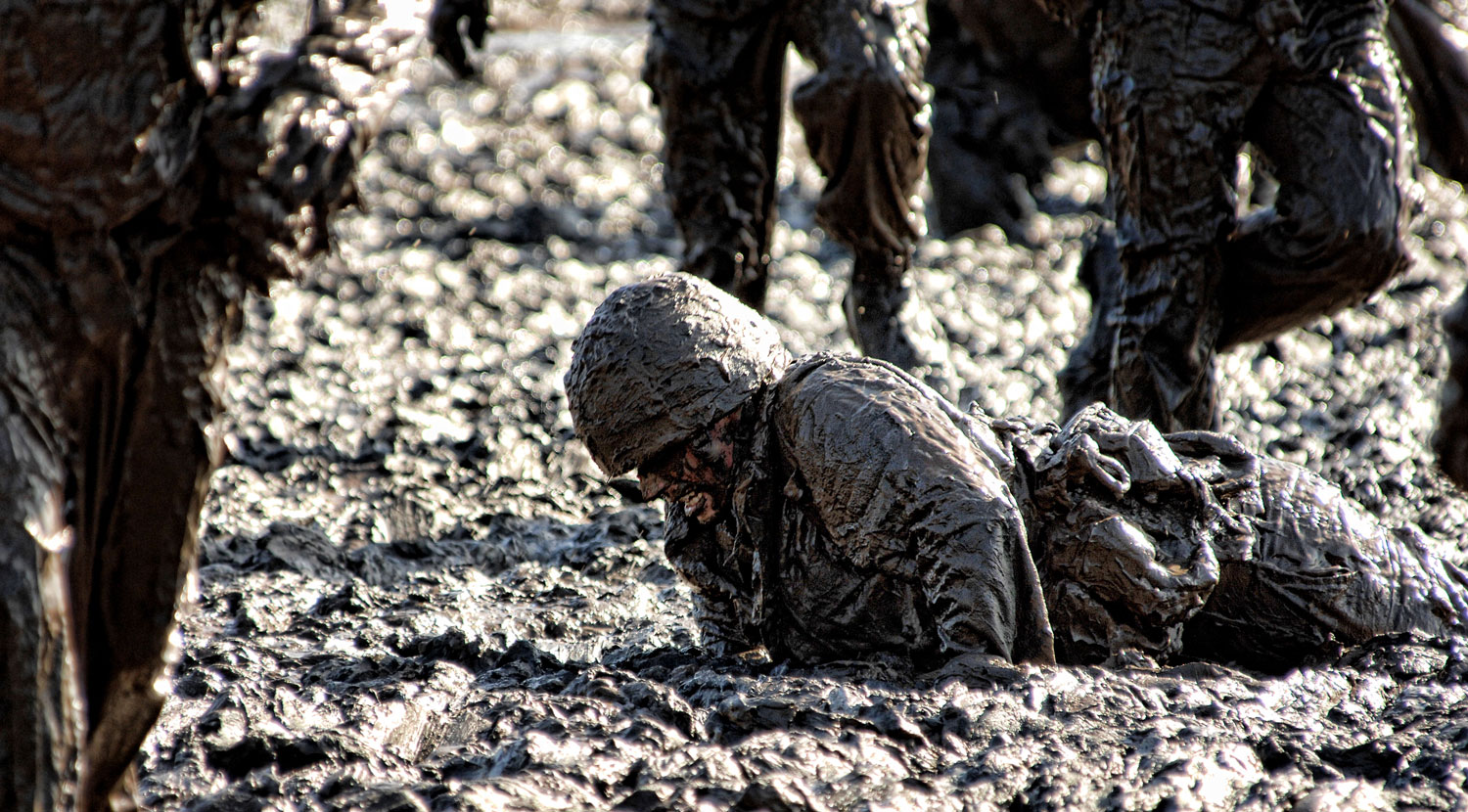 The infamous Mud Run, designed to improve strength, stamina and build teamwork skills of potential Royal Marine Commandos (Picture: Crown Copyright 2013).