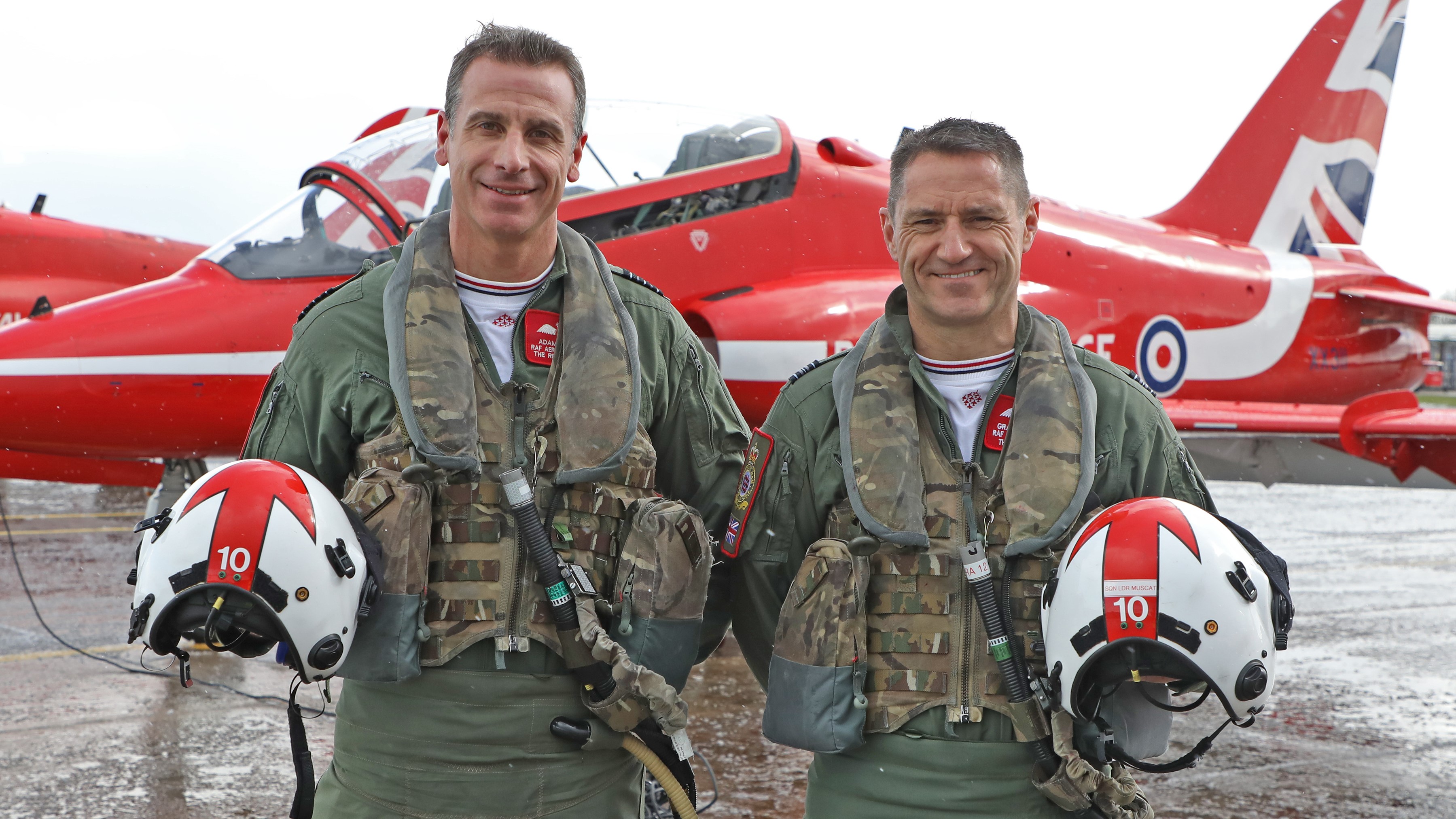 Red Arrows change Wg Cdr Adam Collins, left, handing over to new Red 10 -Sqn Ldr Graeme Muscat, right 04042022 CREDIT RAF MOD.jpg