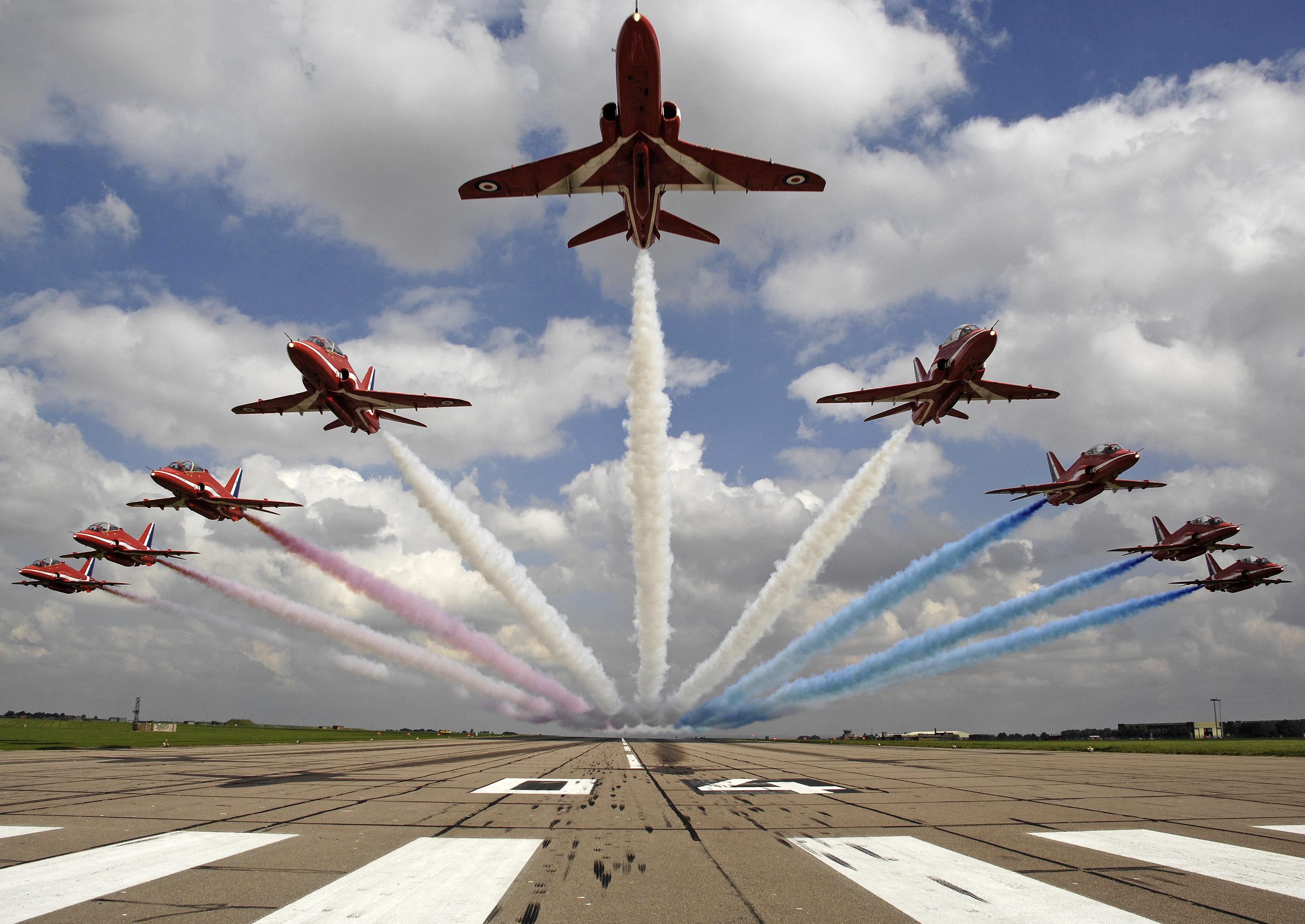 The Red Arrows performing a low level flypast over 04 threshold at RAF Scampton (Picture: Cpl Andy Benson / Crown Copyright).
