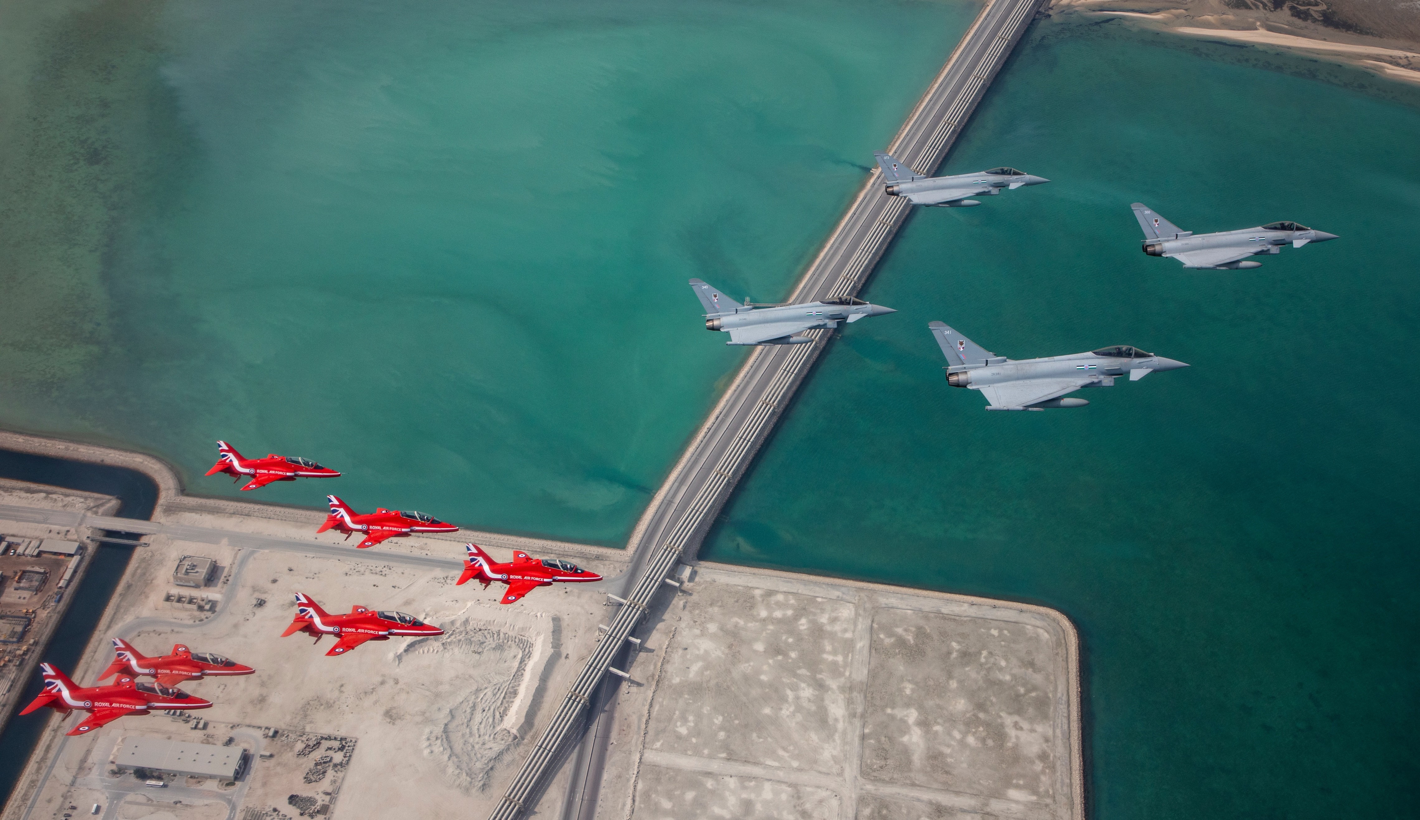 Red Arrows joined QEAF and RAF Typhoon jets for a fly-past in Qatar