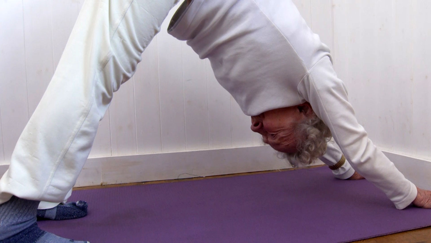 Retired Signaller Dorothea Barron performing a yoga position CREDIT BFBS