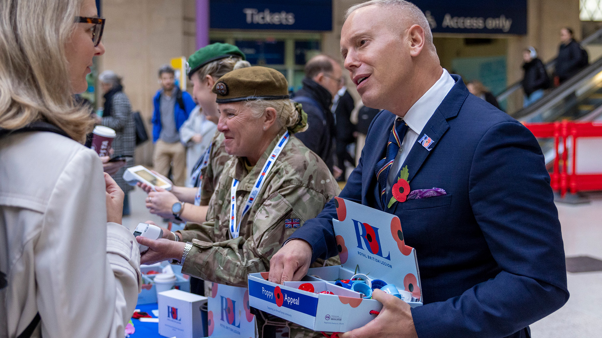 Rob Rinder hands out poppies during the RBL's London Poppy Day 2025 at Waterloo Station (Picture: RBL)