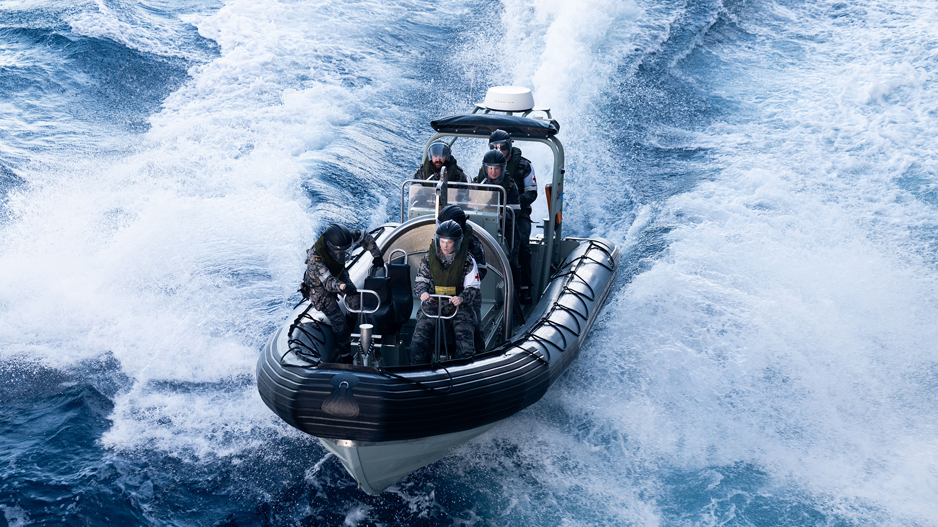 Crews from HMAS Choules conduct boat drills in preparation for the multi-domain exercise