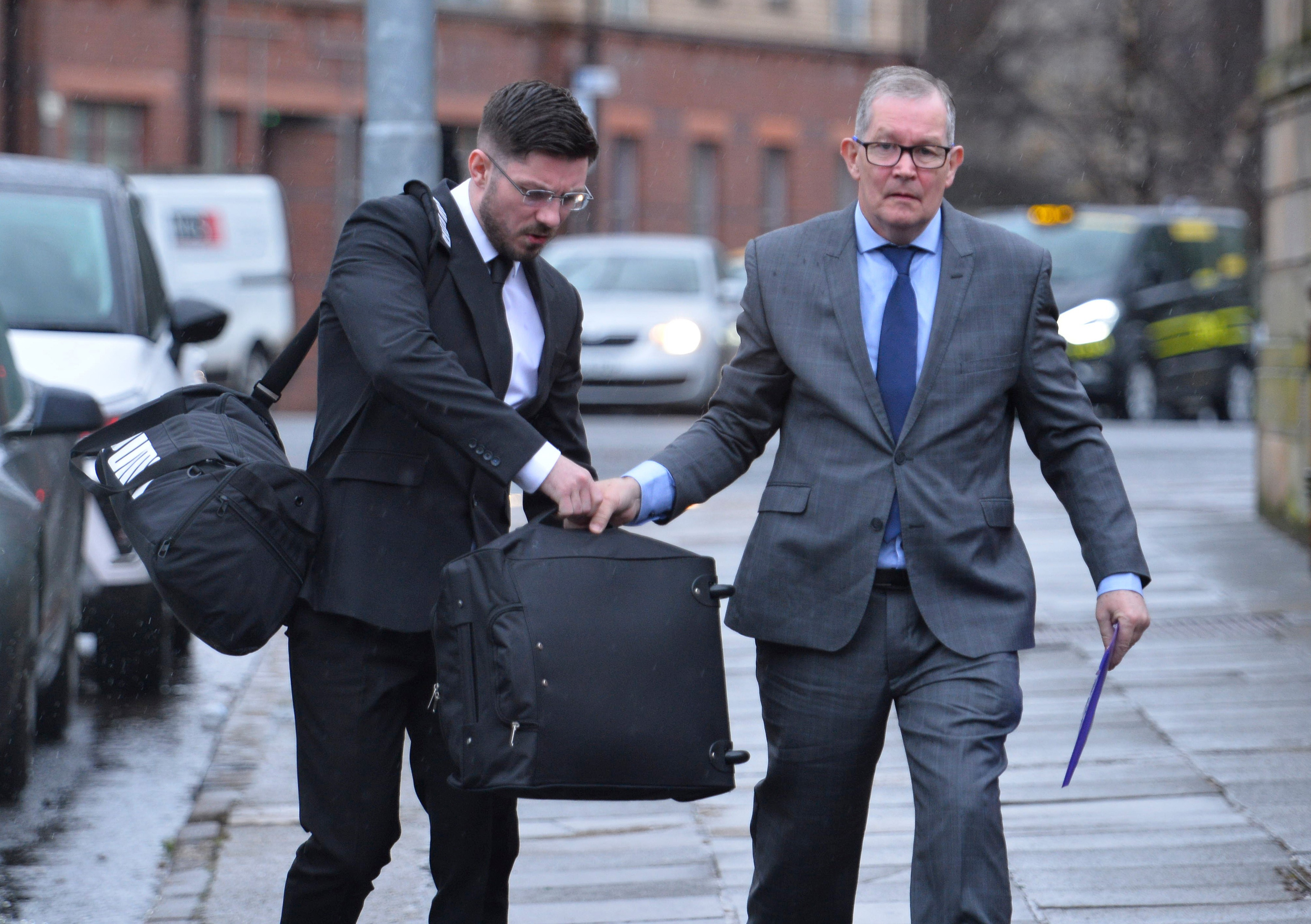 Royal Marine Commando Grant Broadfoot (l) and father Ian Broadfoot (not serving) arrive at Glasgow High Court and sentenced for drug offences using MOD vehicles.