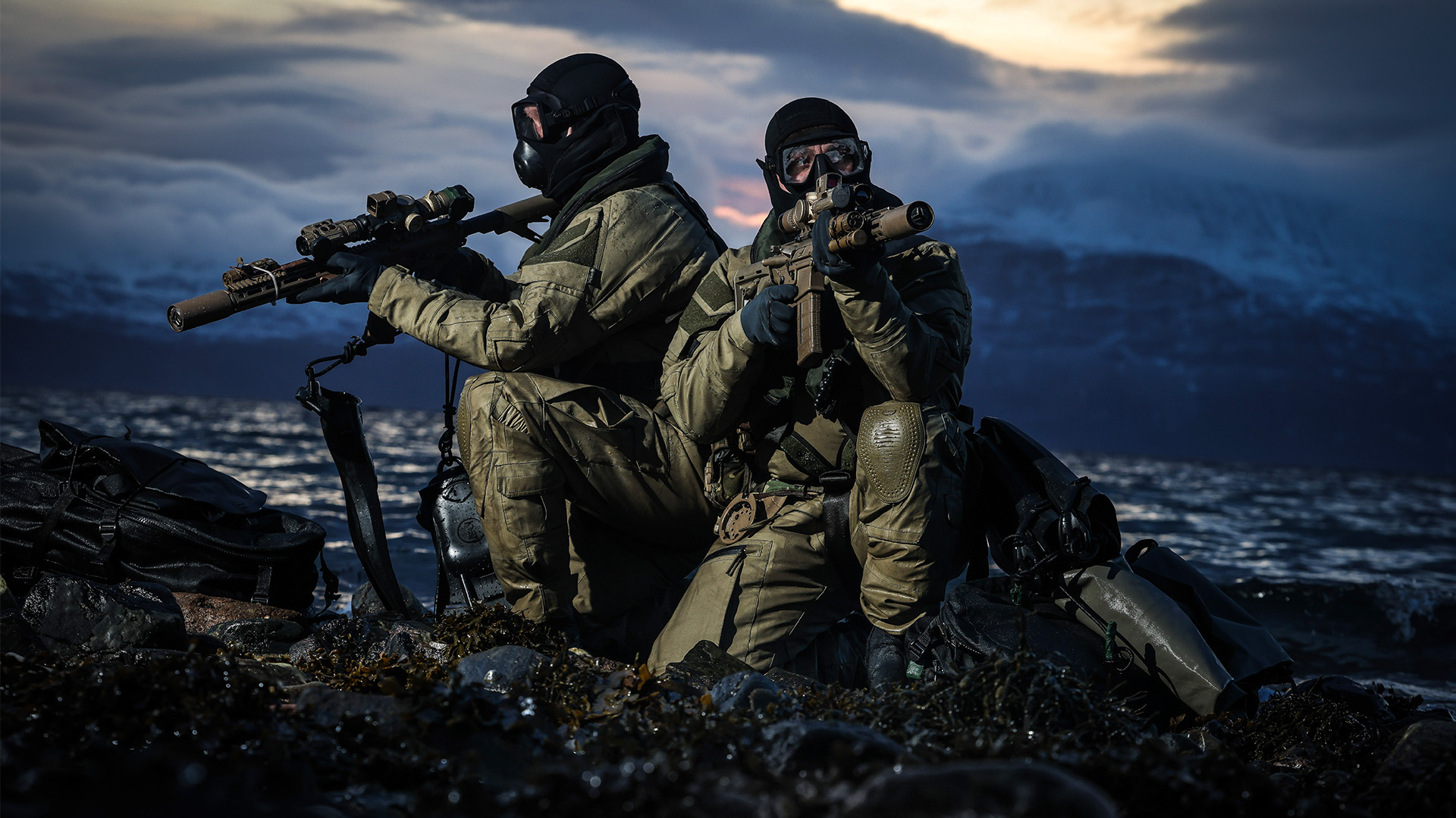 Commandos cover their arcs of fire with their KS-1 assault rifles after landing on the beach