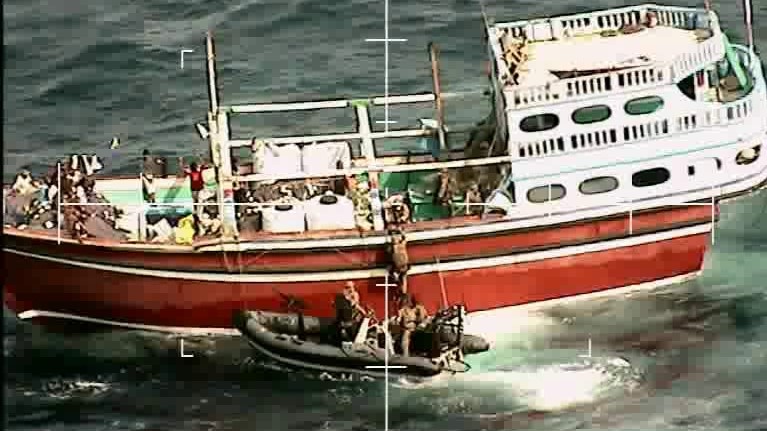 Royal Marines board a dhow - as seen from HMS Montrose's Wildcat helicopter (Picture: Royal Navy).