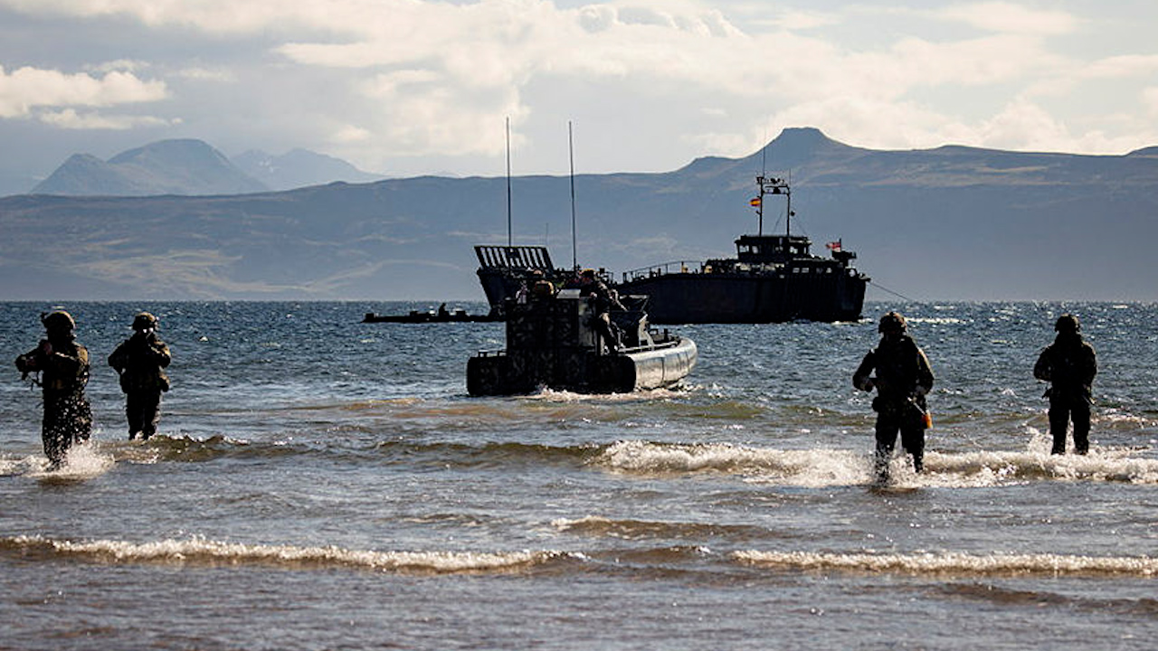 Royal Marines conduct wader drills during Operation Batan, with Commandos return to a waiting ORC raiding craft in the sea, having conducted a beach assault (Picture: MOD)
