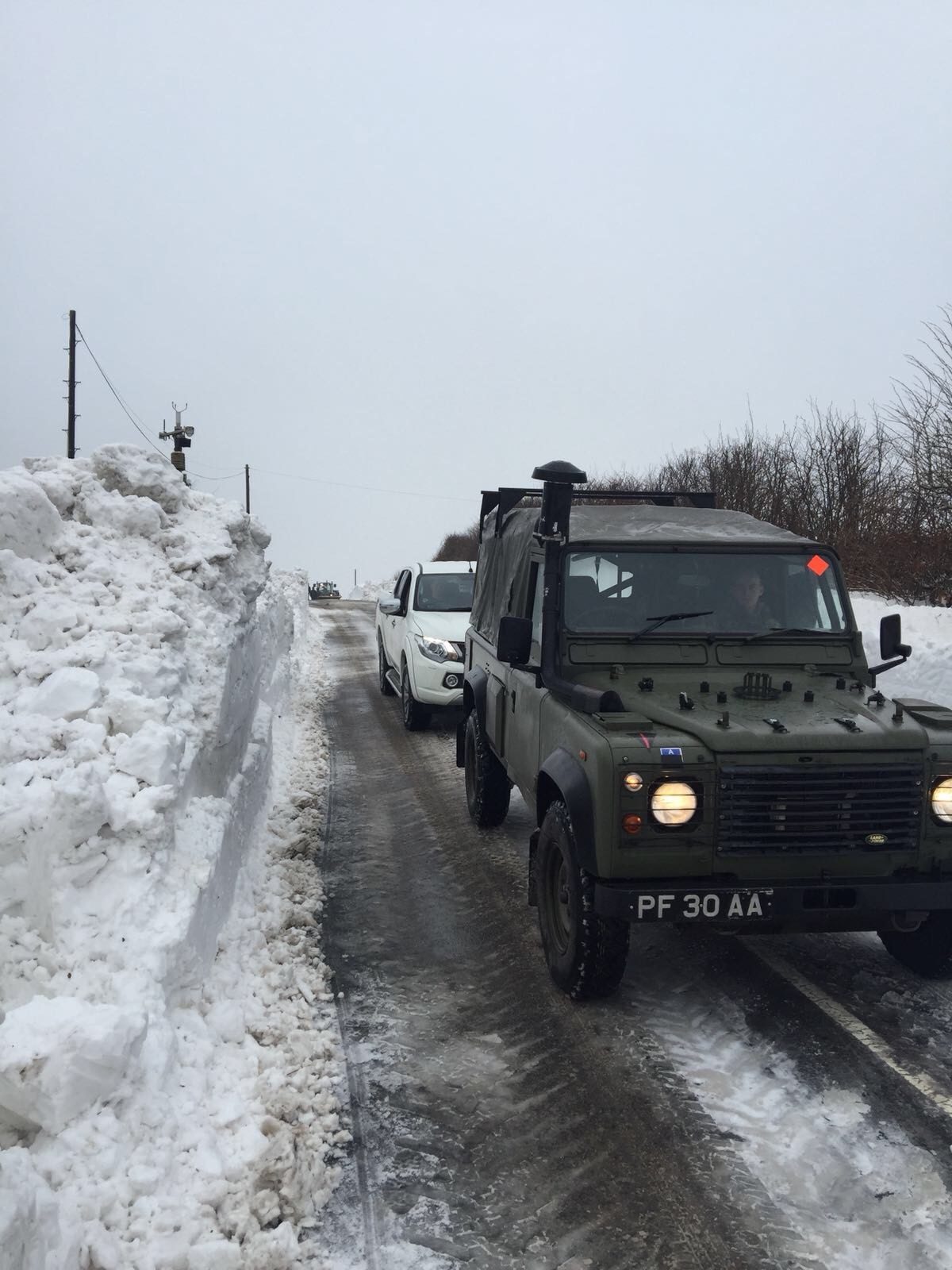 Royal Marines make their way through the snow