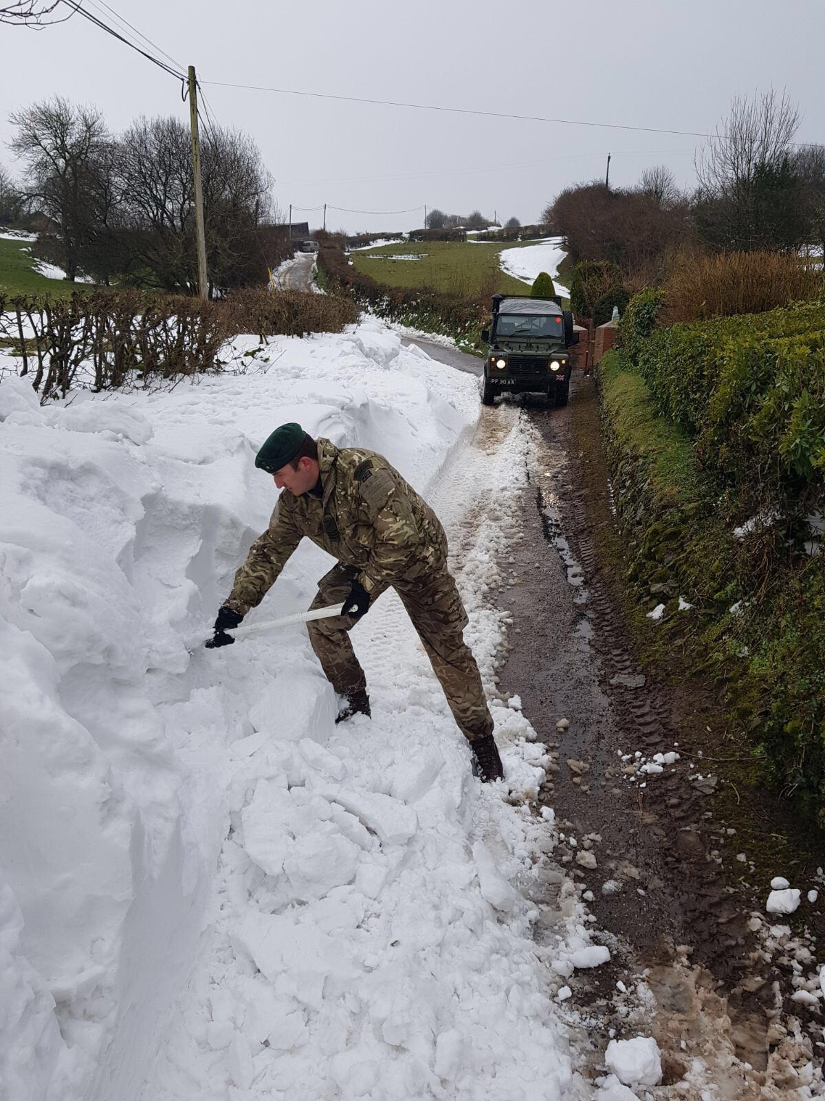 Royal Marines make their way through the snow drift