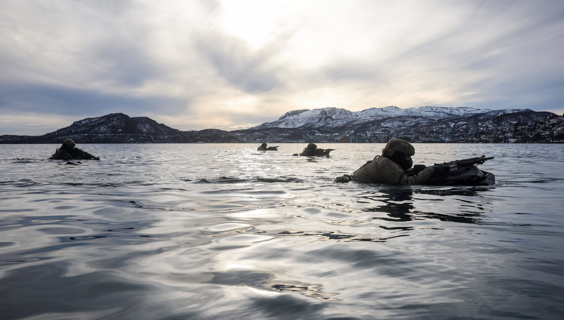 Royal Marine Commandos swim ashore in freezing water