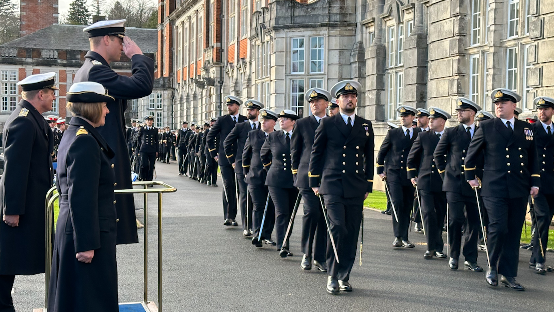 Royal Navy cadets receiving a salute from Prince of Wales at the Lord High Admiral's Divisions at the Britannia Royal Naval College, Dartmouth 14122023 CREDIT BFBS