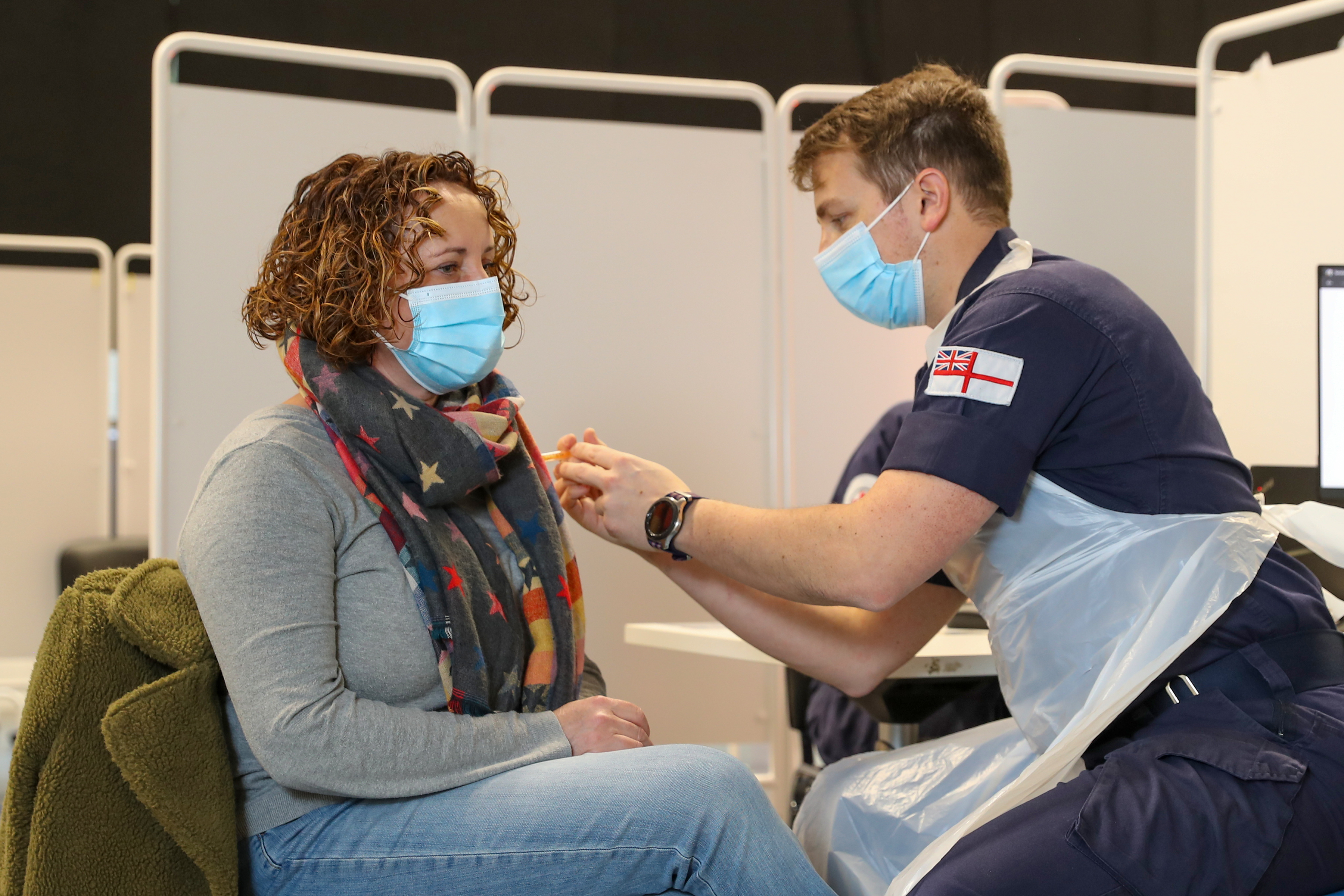 A Royal Navy medic giving a Coronavirus vaccine at Ashton Gate Stadium (Picture: MOD).