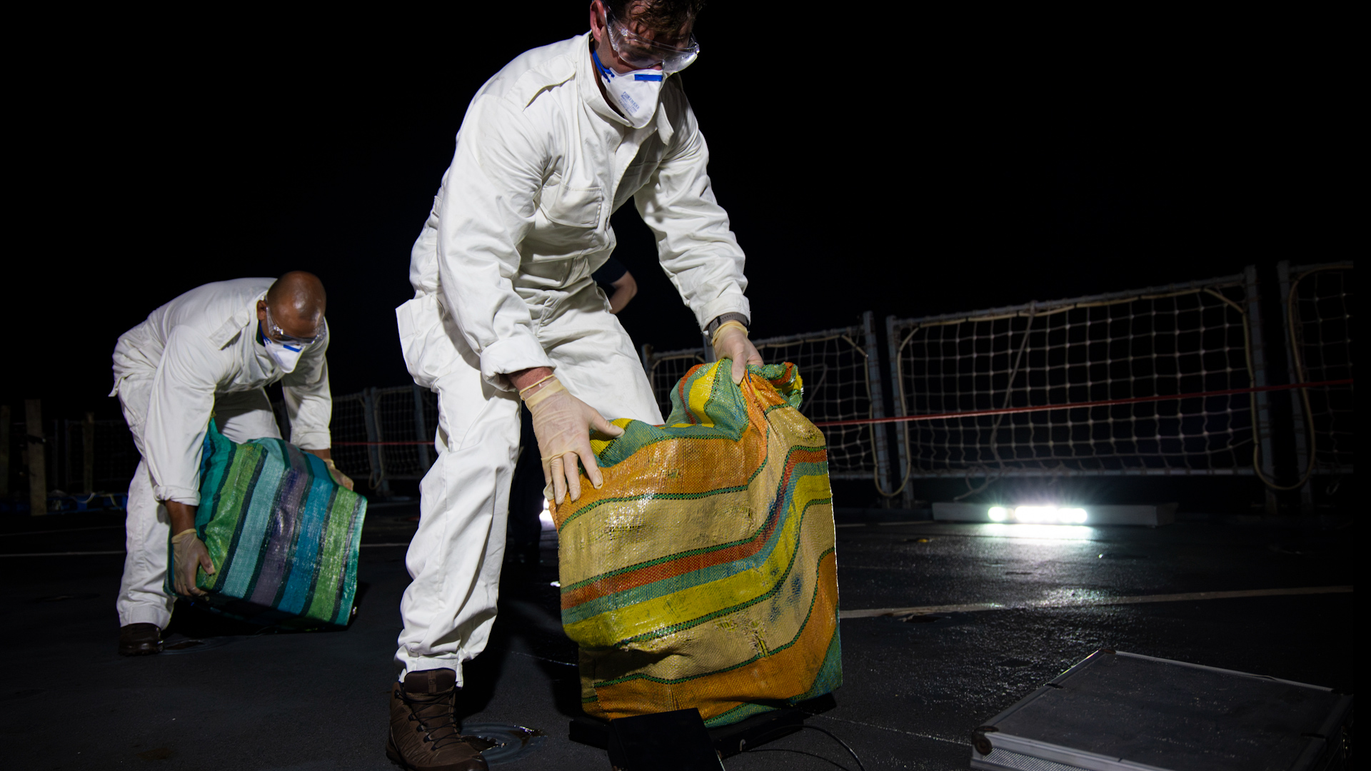 	Royal Navy personnel handling drugs seized by HMS Trent 
