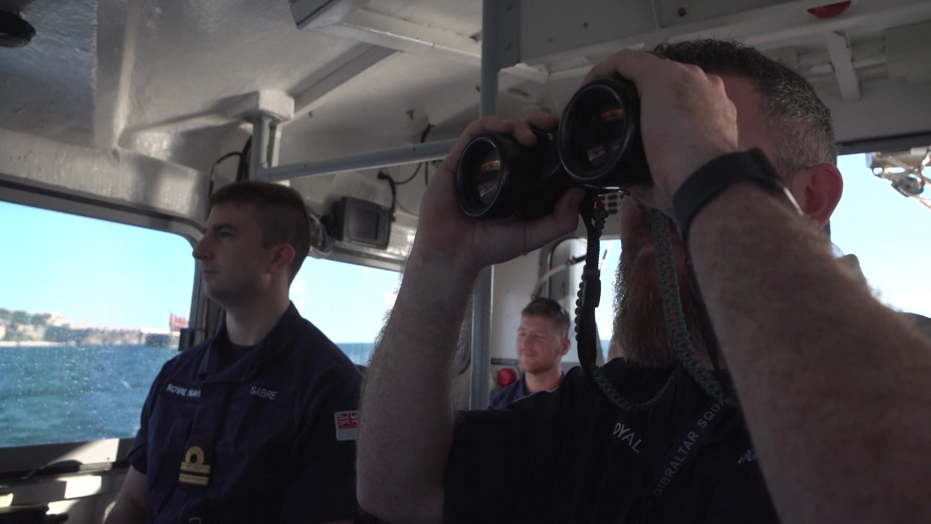 Royal Navy personnel on patrol along Gibraltar's coastline. 