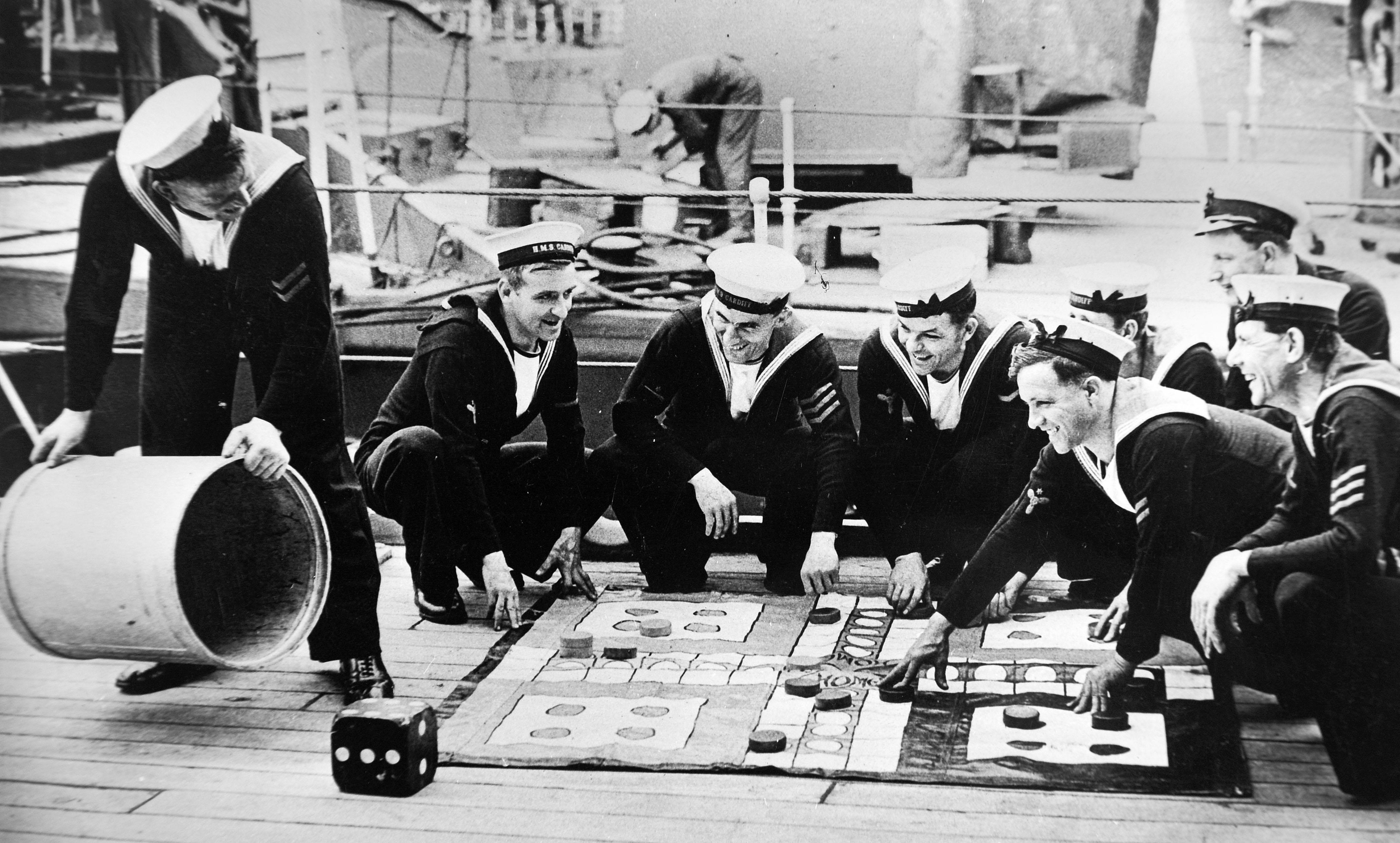 Royal Navy seamen play uckers (Ludo) during a Sunday afternoon break WW2 DATE UNKNOWN CREDIT ALAMY