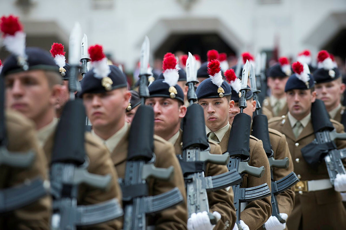 Members of The Royal Regiment of Fusiliers marching in London in 2018, their red and white hackles on display (Picture: MOD).