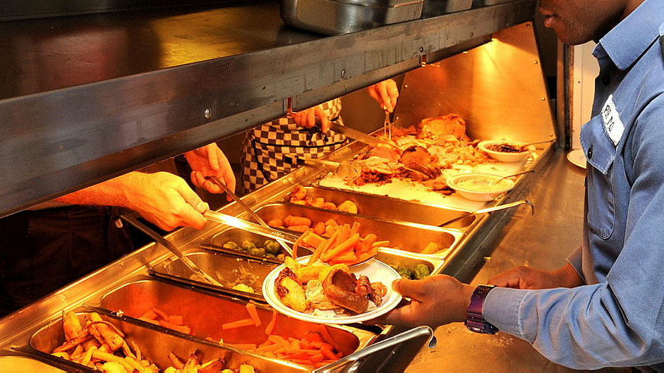 Royal Navy officers onboard HMS Westminster serving sailors their Christmas dinner in 2013 CREDIT Royal Navy