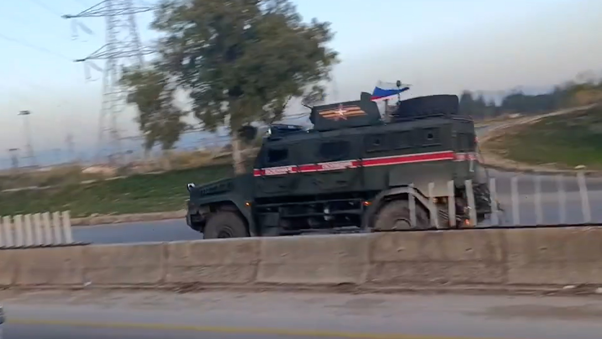 Russian military convoy passing rebel fighters in Western Syria 12122024 CREDIT SimNassr X