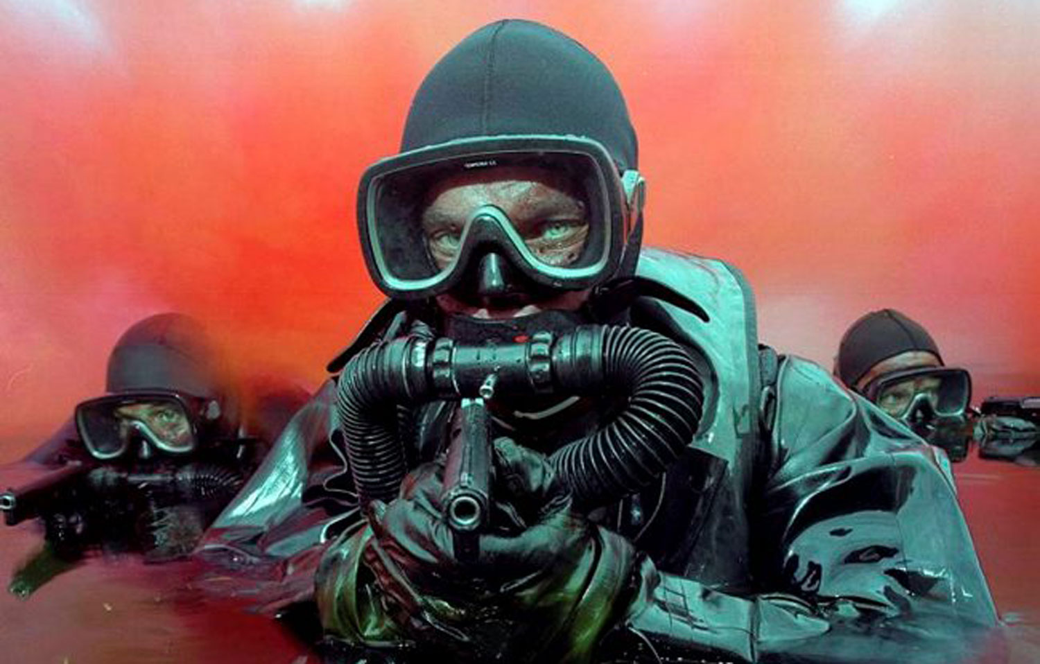 Royal Marines emerging from red smoke used as cover for an attack Royal Marines emerging from red smoke used as cover for an attack