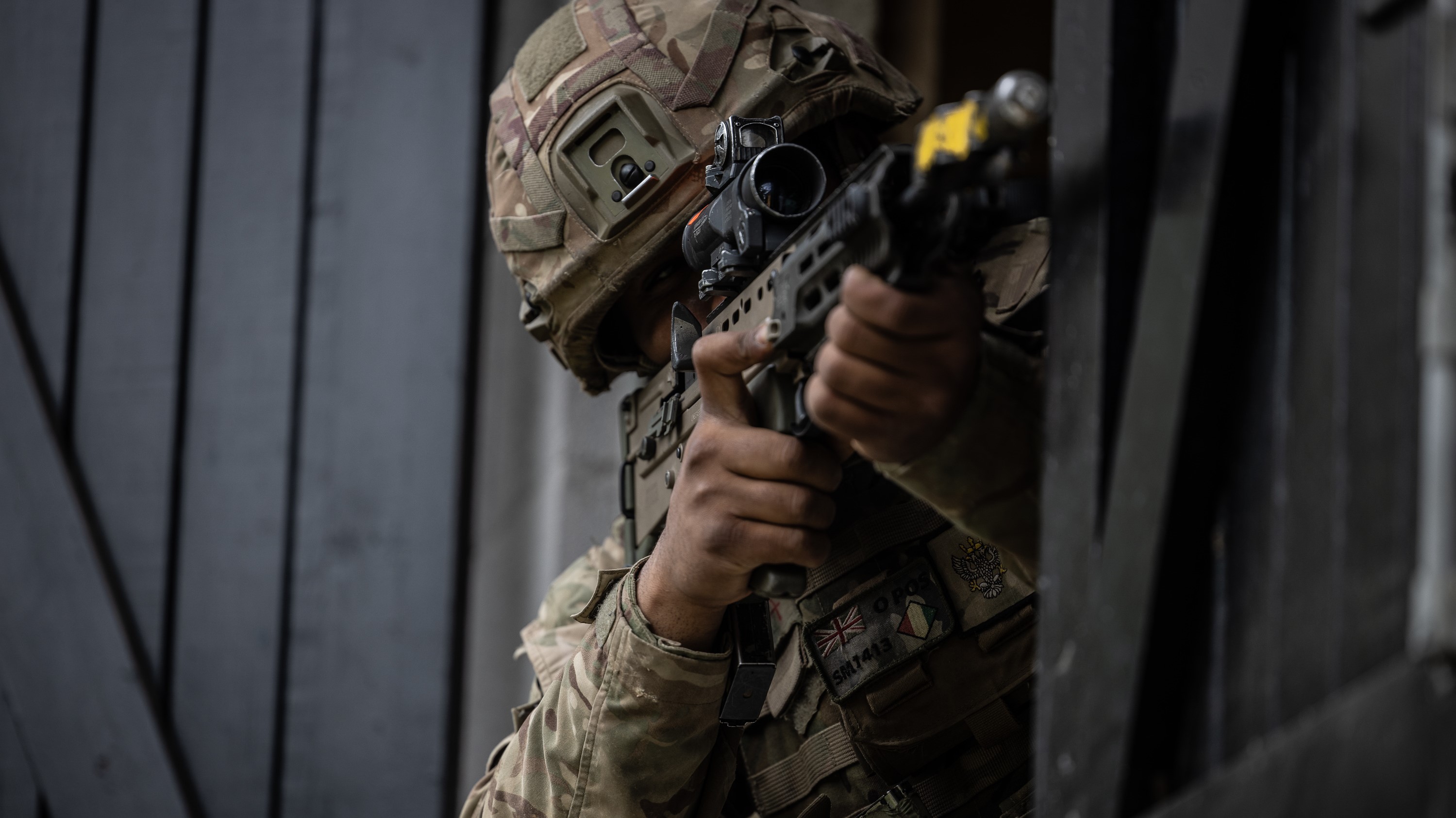 Soldier in a fire position on an urban assault during Exercise Iron Cyclone