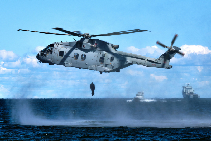 A Royal Marine from 4 Assault Squadron, HMS Albion, jumps (Helocasting) from a Merlin helicopter into the sea to link up with inflatable raiding craft during an amphibious landing exercise taking place at Kolga Bay, Estonia.