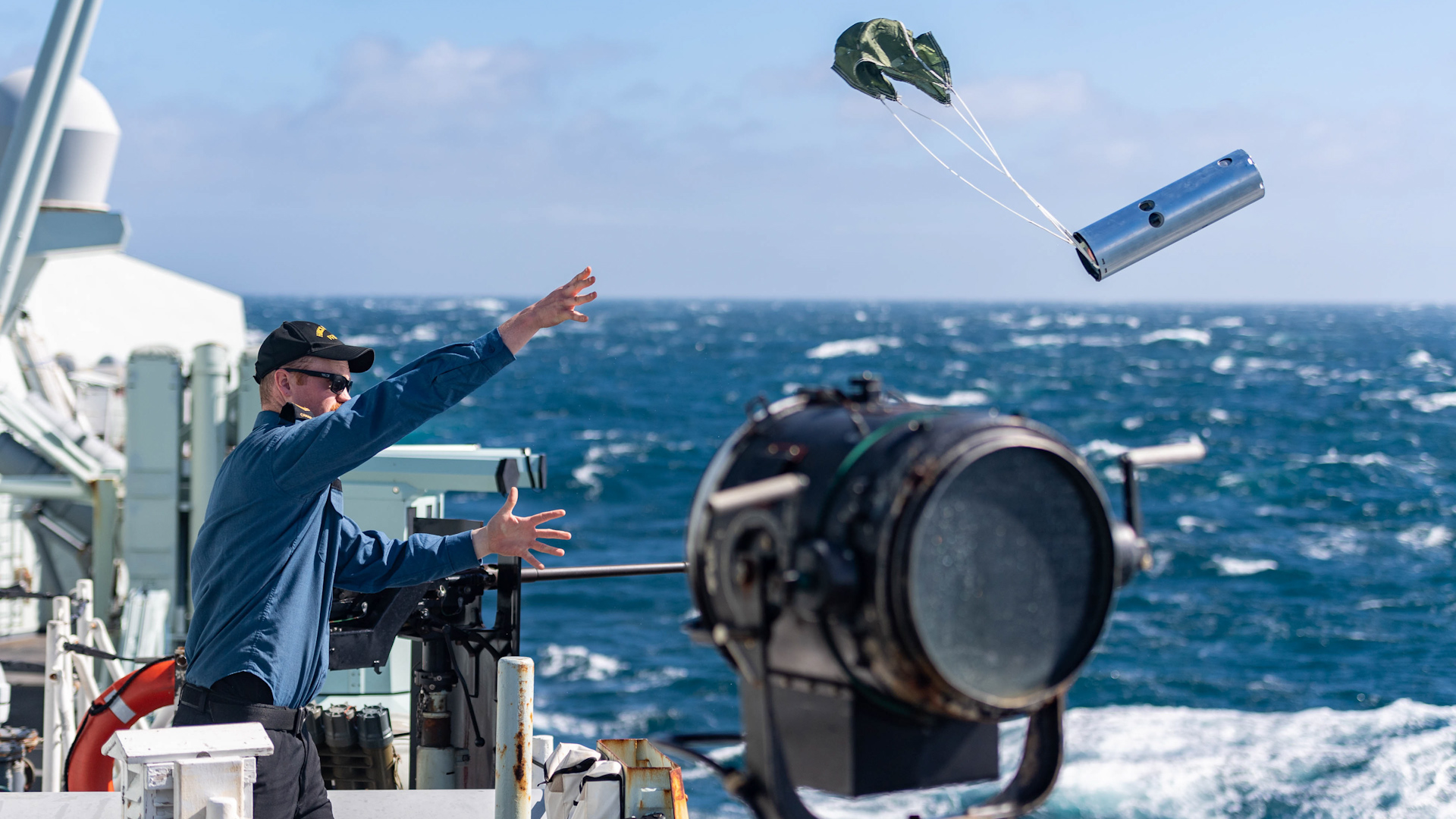 Sailor 1st Class Doug Steele of HMCS Halifax casts a sonobuoy into the Atlantic during Ex Dynamic Mongoose 22 DATE UNKNOWN CREDIT NATO.