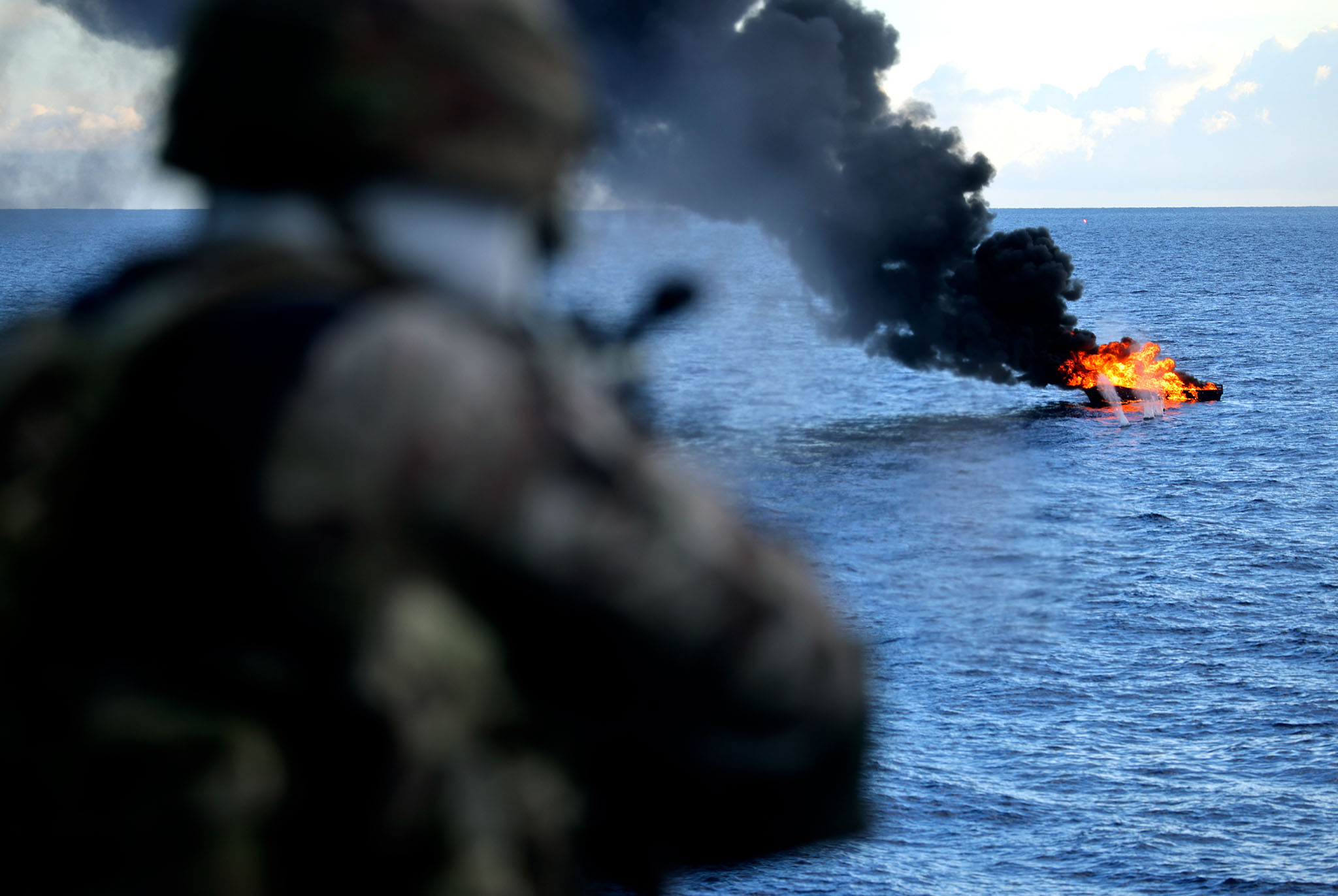 Sailor onboard HMS Medway destroying a drug-smuggling vessel 281022 CREDIT MOD