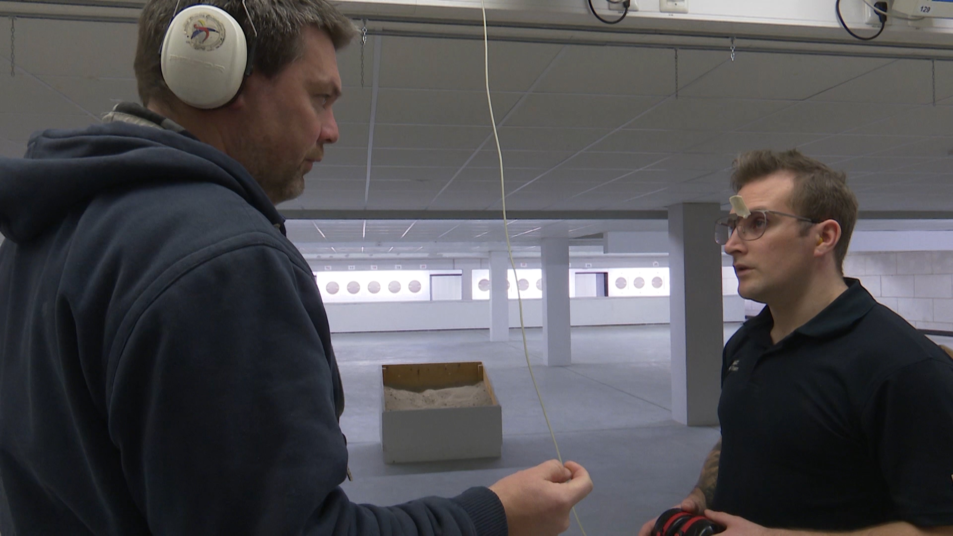 Sgt Gowin (right) takes instruction from his coach, Philip Bernhard.