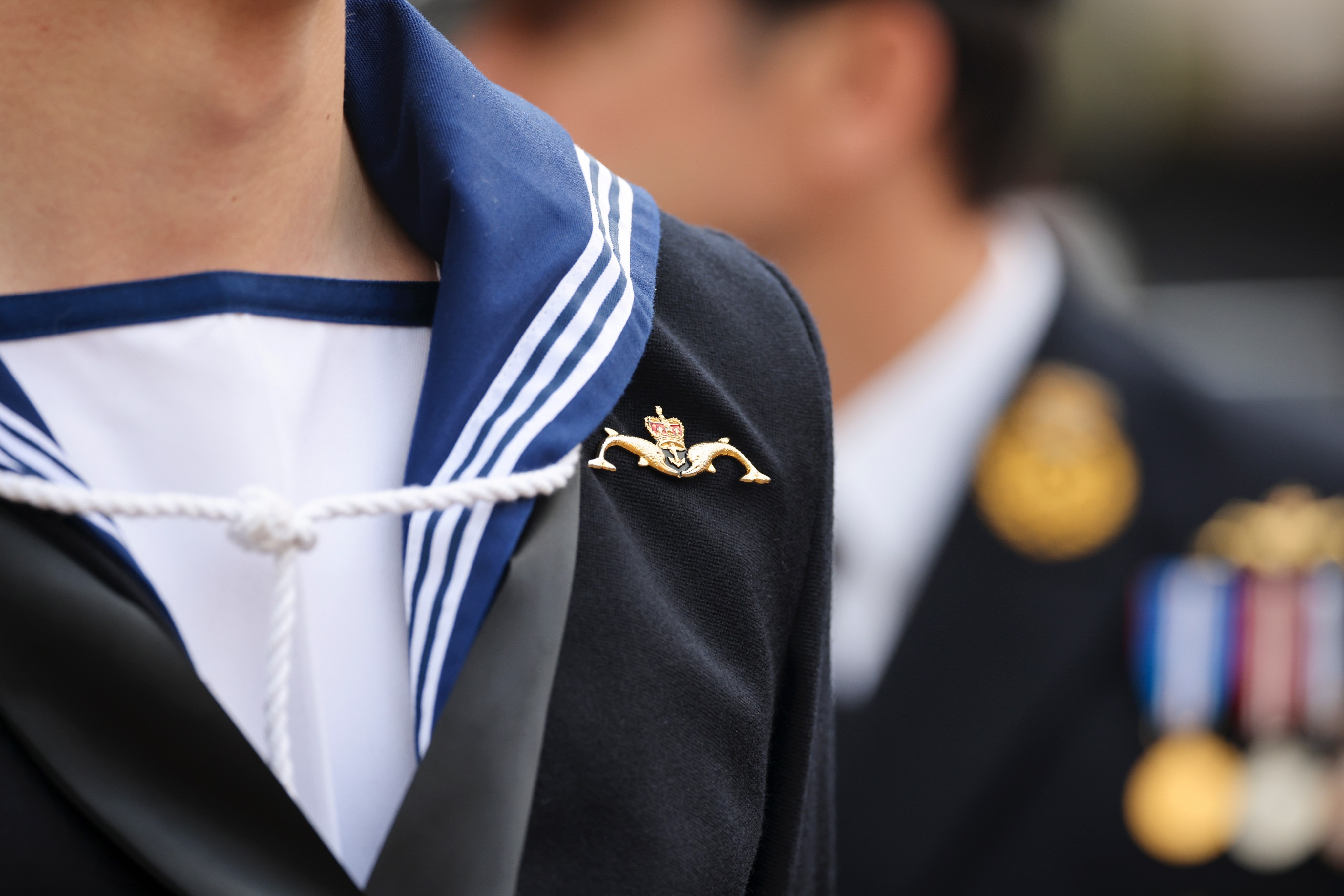 Semi-anonymous sailor with submarine service pin at HMS Audacious commissioning