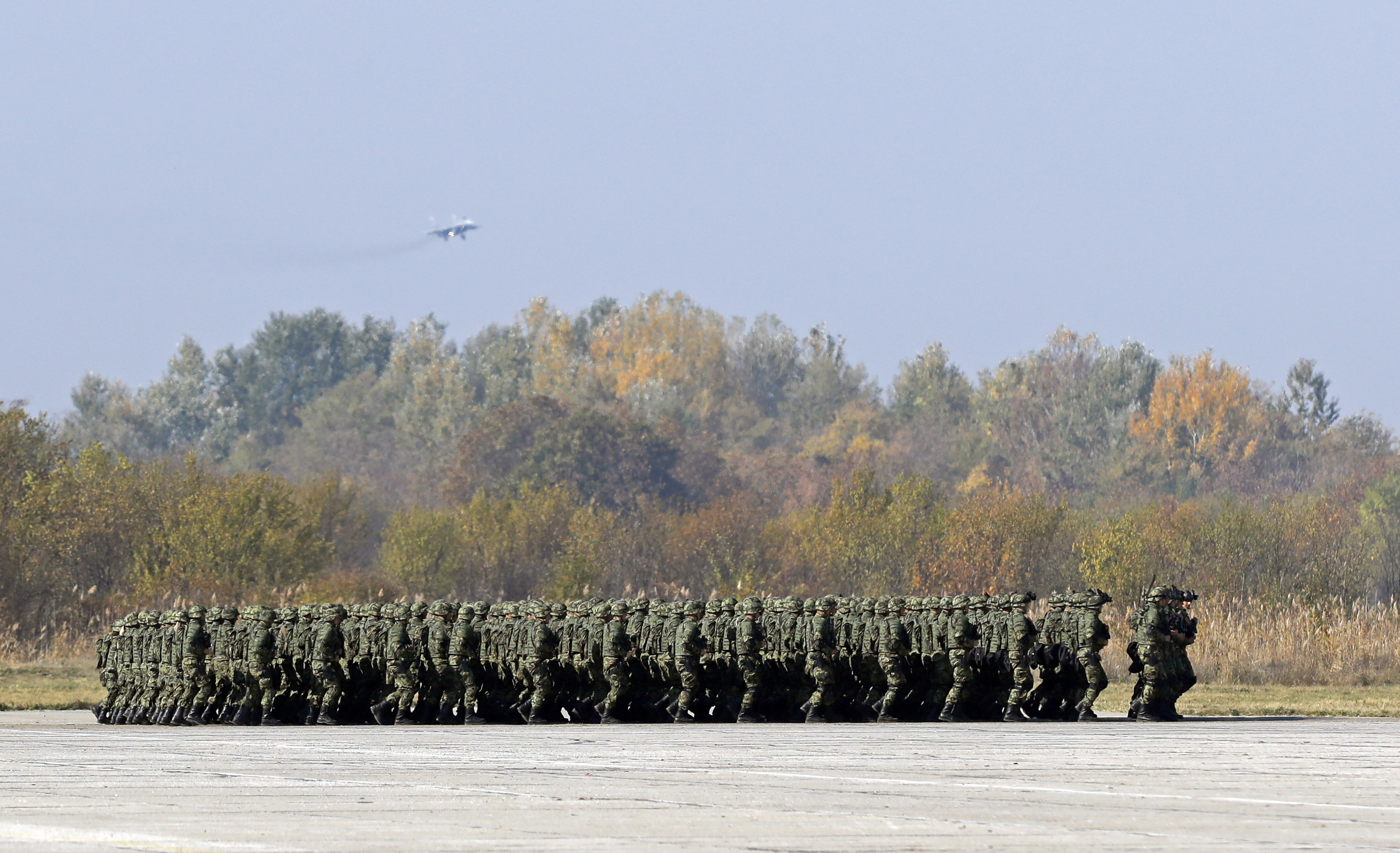Serbian infantry force members march during a military parade