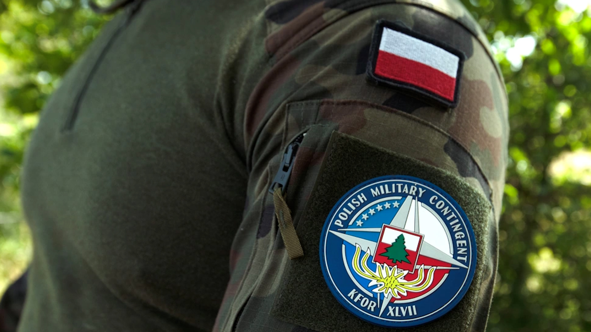 Sergeant Tomaka Macieke, an infantryman with Regional Command-East Polish Contingent, patrols along the administrative boundary line