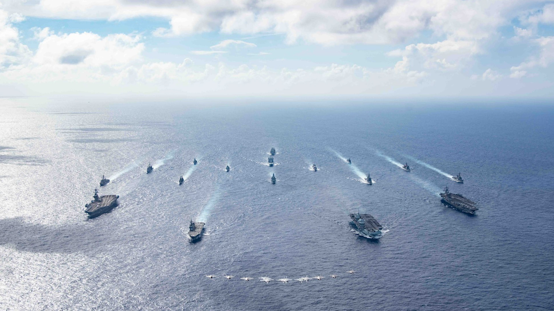 Ships deployed on the Carrier Strike Group 21 deployment carrying out quad carrier operations alongside the US and Japanese navies