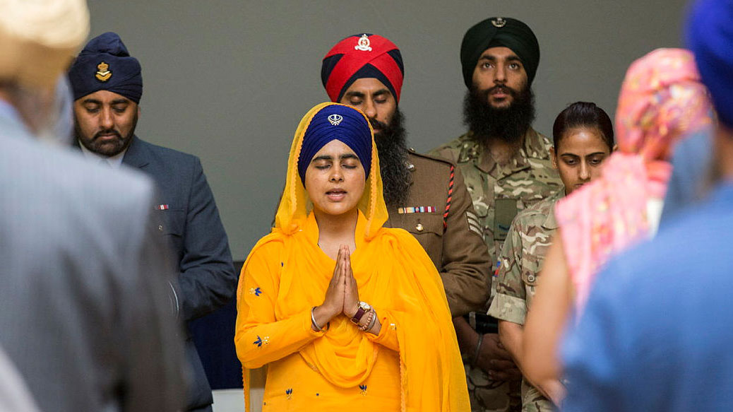 Sikh Chaplain Armed Forces Mrs Mandeep Kaur leads the audience in a commemorative prayer Credit MOD Crown Copyright Sgt Ross Tilly RAF