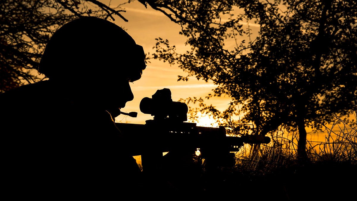 Soldier of 34 Squadron, RAF Regiment, taking cover in a defensive position after coming under contact from enemy forces during a late afternoon patrol (Picture: MOD).