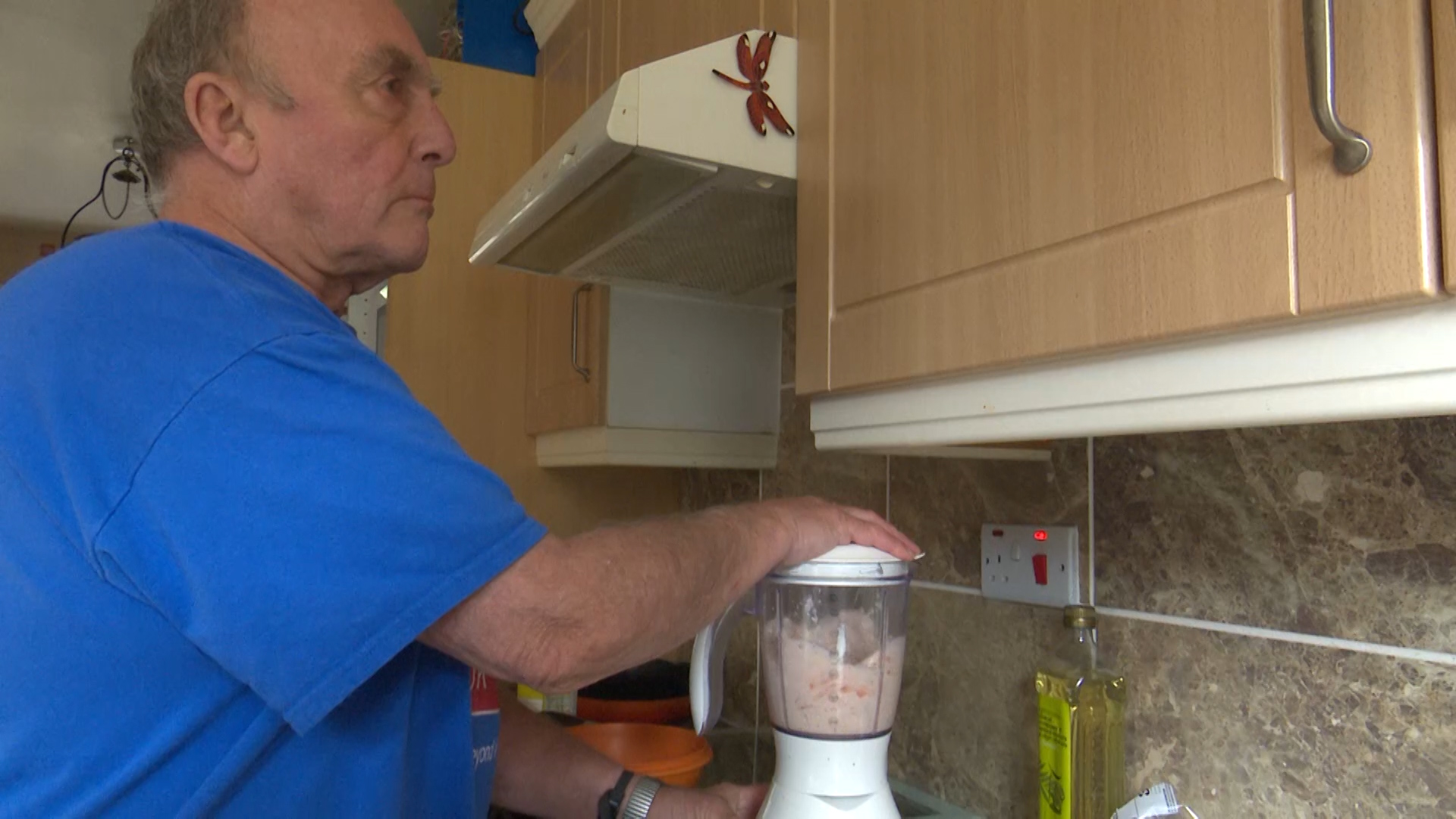 Simon Mahoney, a former Royal Marine, preparing food in his kitched, and will release a cookbook in an attempt to inspire others with sight loss to get back into the kitchen
