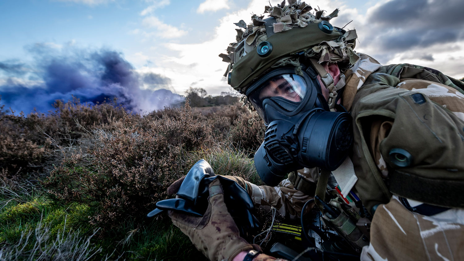 A member of 1st Battalion Scots Guards prepares himself for a CBRN attack scenario on Ex SHADER TEMPEST Credit MOD 2020