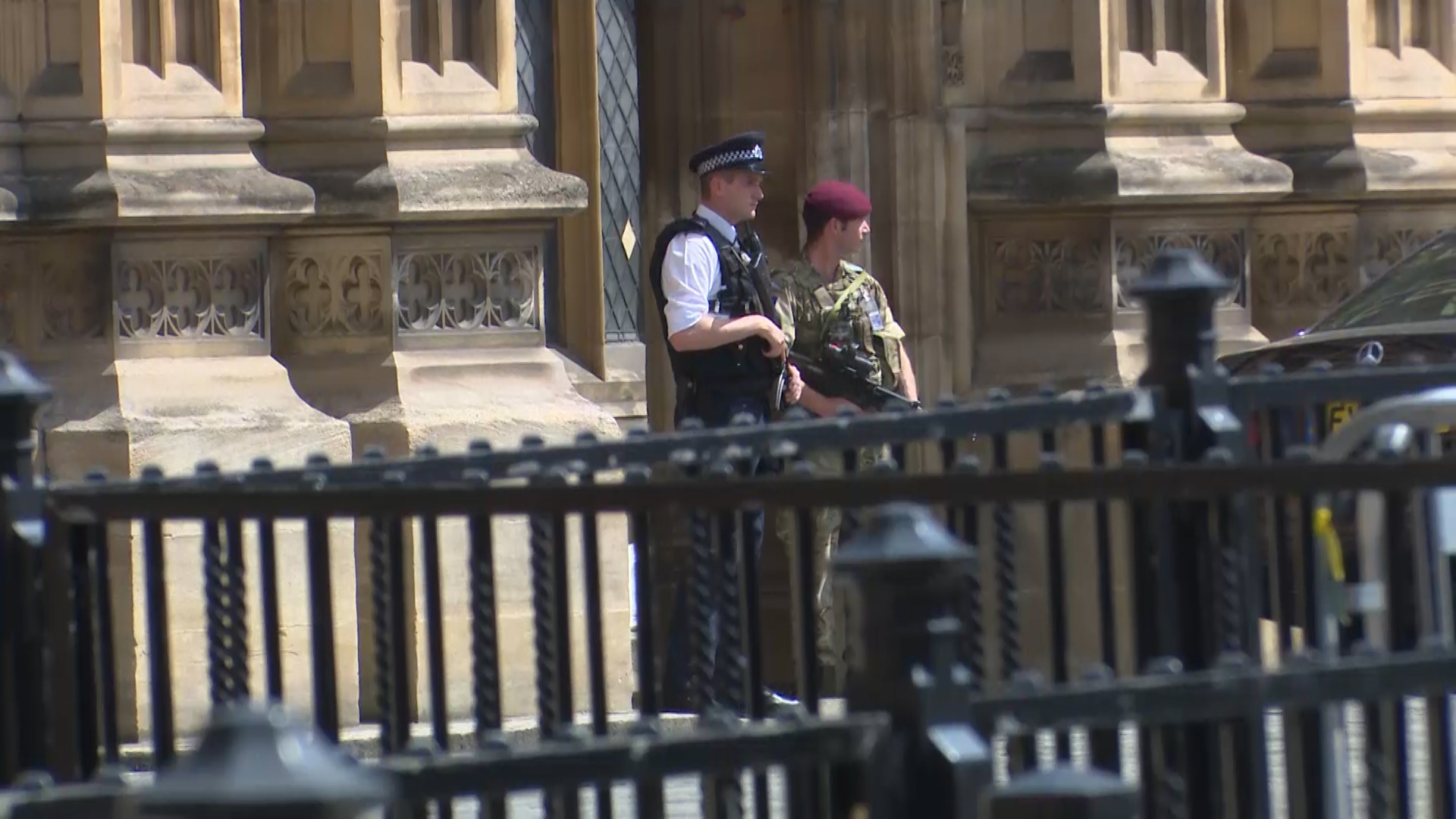 Armed policeman and soldier at Parliament
